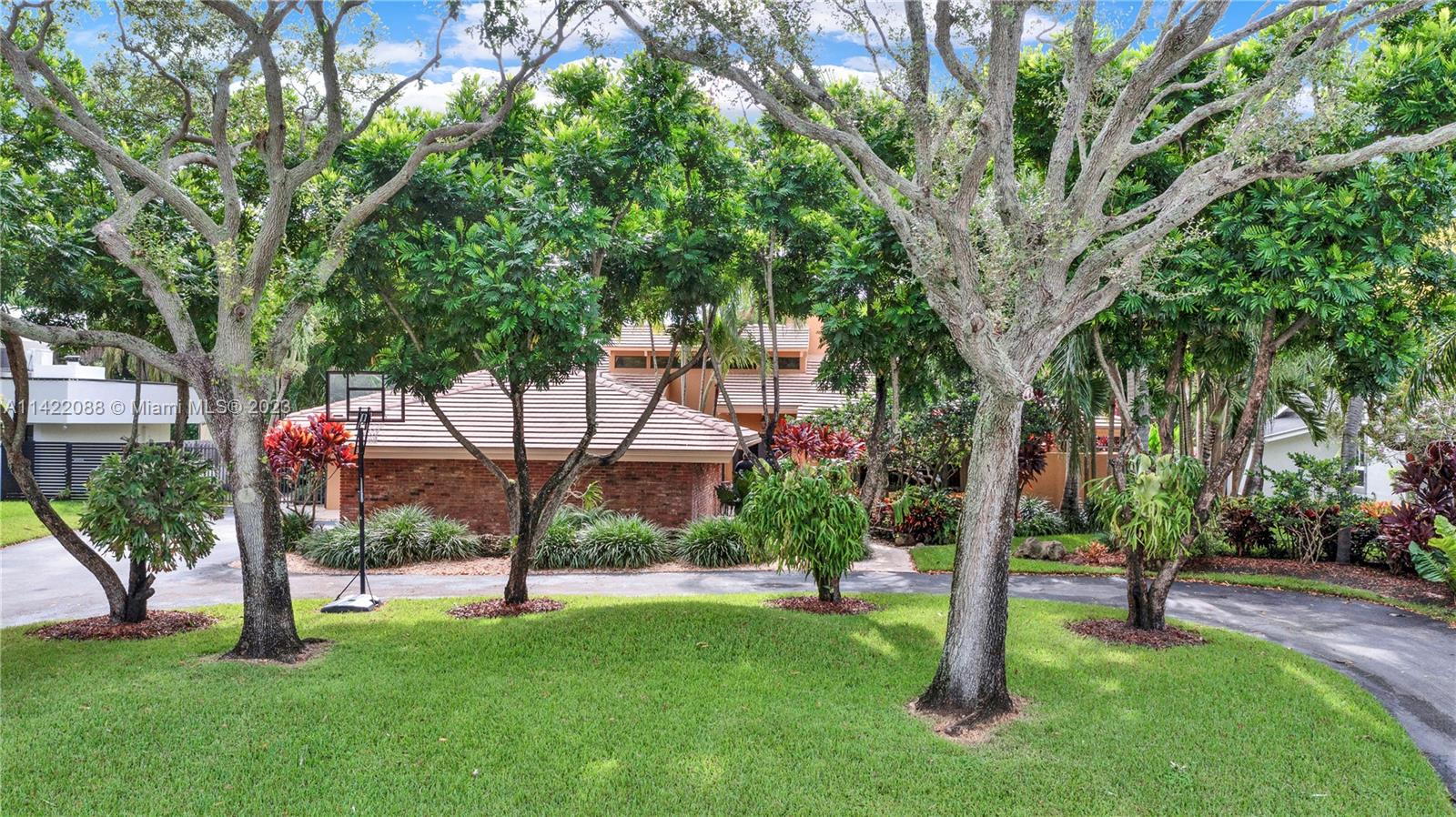 An exquisite 4 bedroom, 3 bath home nestled on almost .5 acre of lushly landscaped lot in Village of
Palmetto Bay; one of the most prestigious neighborhoods Miami Dade County. A grand Chicago brick-walled entry opening to formal living & dining rooms, eat-in kitchen with double ovens & pantry, family room w/wood burning fireplace & wet bar, surround sound in common areas & patio, a split floor plan & all fully renovated bathrooms. Step outside & discover a private tropical oasis with meandering paths, a spacious gazebo, large deck, refreshing swimming pool and a fully equipped outdoor Kitchen with bar & wine cooler for alfresco dining and year-round entertaining. Home features Impact doors & windows, pool/landscaped lighting. Let this magnificent home capture your heart!