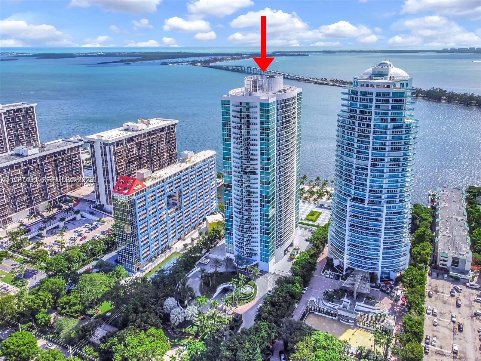 This stunning apartment offers a resort-style lifestyle with a range of amenities including a marina, fitness center, tennis court, spa, pool, party room, children's playground, dog walk, convenience store, valet, resident lounge, and BBQ area. The apartment features a spacious private terrace with fantastic bay and city views, granite countertops, in-unit washer/dryer, and a beautiful walk-in closet.