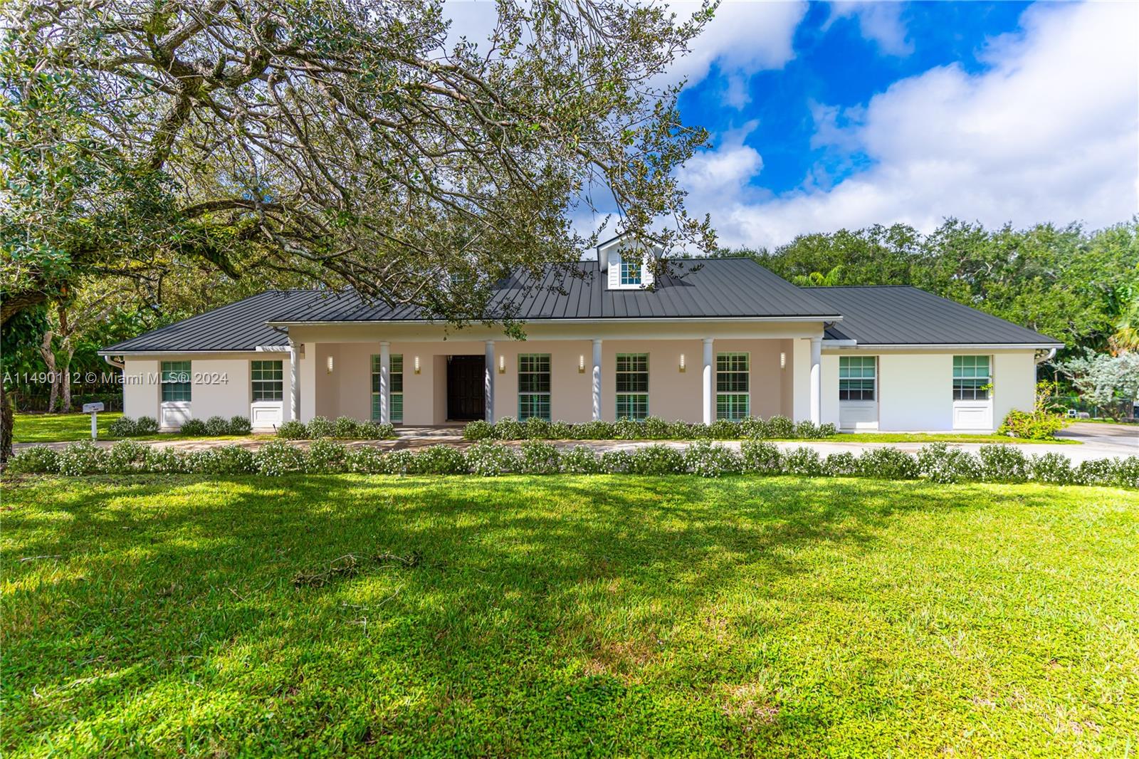Nestled in the prestigious Snapper Creek Lakes guard gated community, this lovely two-story home completely re-built in 2009 offers a blend of elegance and comfort. The grandeur of tall ceilings and expansive windows flood the interior with natural light, creating a warm and inviting atmosphere throughout. The main level presents a generous living space, complemented by a chef's kitchen and ample storage. Upstairs, the bedrooms provide a peaceful retreat, offering serene views of the surrounding 1.34 acre lot. Outside the enchanting waterfront setting offers lovely views of the pool, lake, and tree canopy. A community marina with private boat dockage and ramps, offers endless opportunities for leisurely water activities. Embrace the allure of lakeside living in Snapper Creek Lakes.