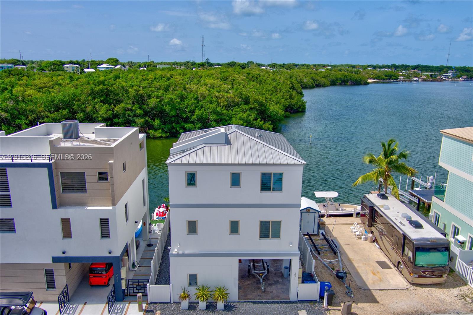 Rare daily rental opportunity in Key Largo! Turn-key 3 bed/3 bath home in gated Calusa Campground with approx. 1,571 sq. ft., elevator, open water views, dockage with boat lift, and direct boating access straight to open waters. Daily rental flexibility is uncommon in Key Largo, making this ideal for investors, vacation-home buyers, or full-time Keys living. Fully furnished and ready to enjoy. Buyer to verify rental rules, dock details, and association restrictions.