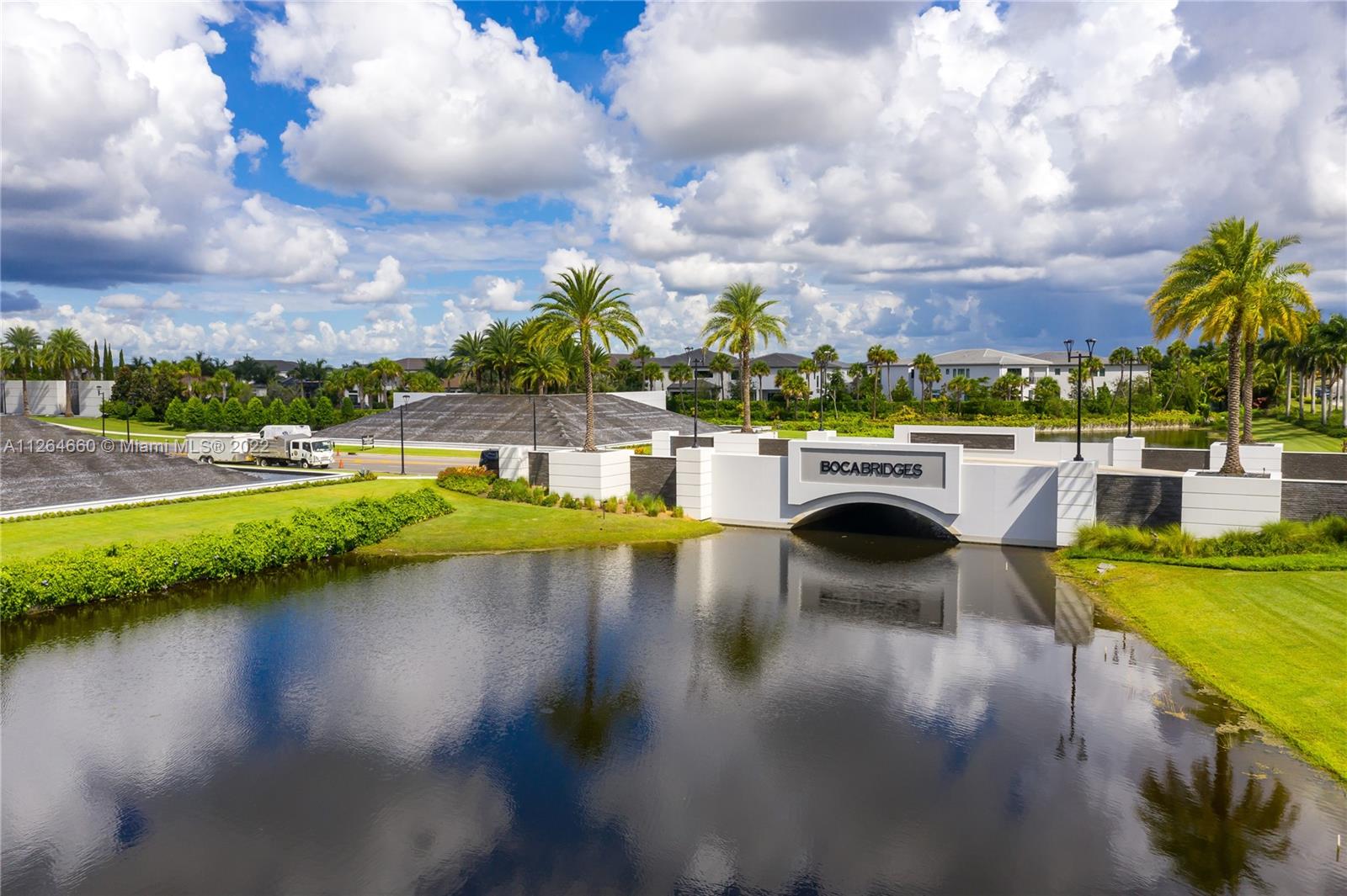 BRAND NEW Never Lived in!!! Amazing opportunity in the luxurious community of Boca Bridges is priced to sell. this one story Mediterranean modern home sits on 3,637 sq. ft. of entertainment space. Builder 1-year warranty conveys to new owner from date of completion! This home features 3 bedroom plus a den, 3 1/2 baths, 3 car garage with epoxy floor finish, an extended driveway for additional parking, stunning white gourmet kitchen with KitchenAid stainless steel appliances, oversized quartz countertops, double oven, 5-burner gas top, porcelain tile floor throughout, custom walk in closets, spacious laundry room, covered patio, heated pool,  and upgraded summer kitchen with gas line.