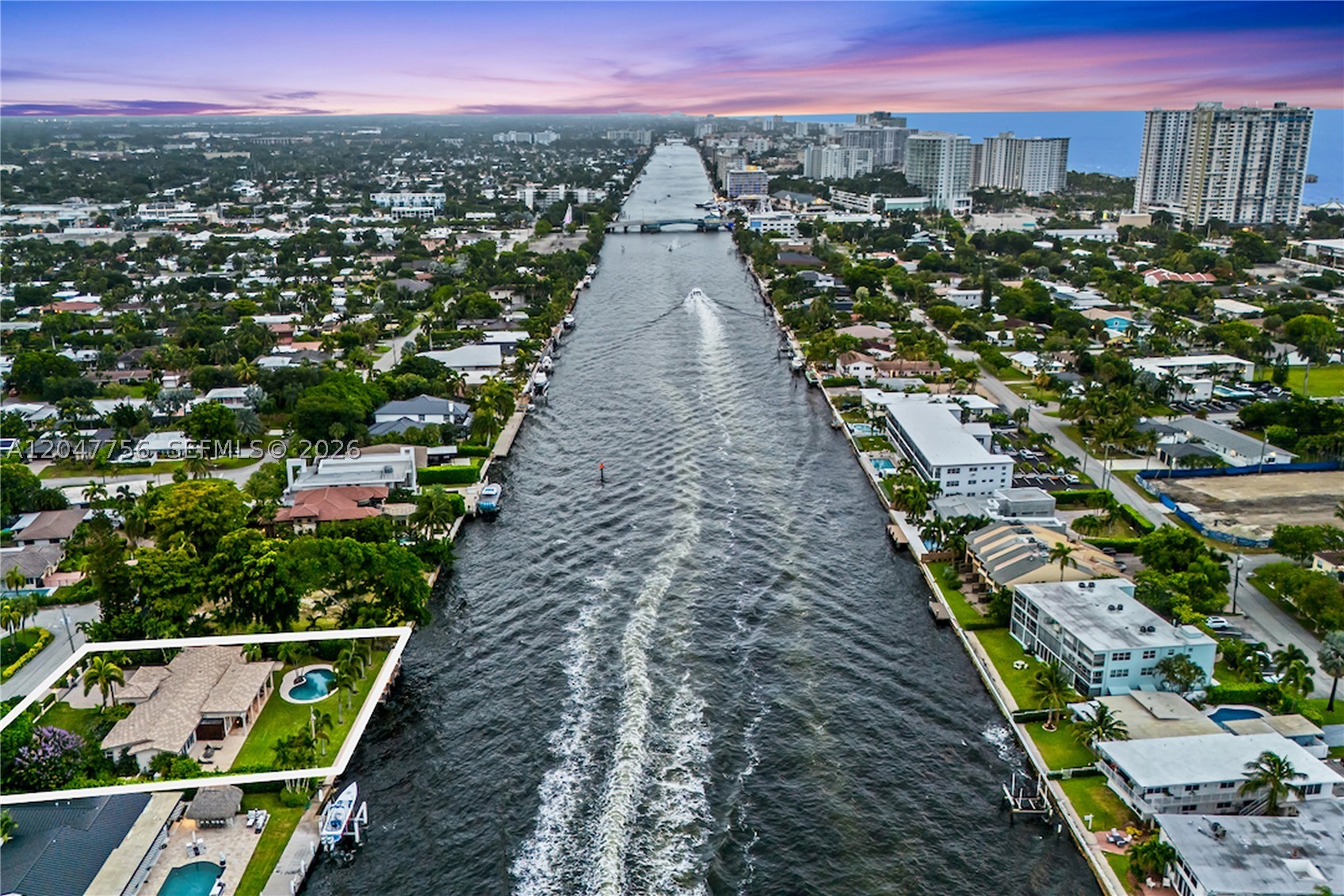 Wake up to the water. Nearly half an acre with 132 feet of direct Intracoastal frontage. Heated pool, large yard and east-facing patios open onto a 300-foot-wide channel and the steady parade of boats heading out to sea. No fixed bridges and less than three miles to the Hillsboro Inlet, with unrestricted ocean access and dockage for a yacht up to 117 feet. The interior lives up to the setting. The water-facing primary suite opens through 15-foot pocket doors to a patio with a gas fireplace. Chef's kitchen built around a full Sub-Zero and Wolf suite. Control4 smart home controls lighting, whole-house A/V, and a home theater with a 90" 4K HD screen and eight-channel surround sound. Ten-camera security, two-zone climate, tankless gas hot water. Impact glass throughout, and a whole-house generator. Extra-wide two-car garage and additional parking behind a private gated entry.
Turnkey and ready in the heart of Pompano—on waterfront that rarely trades.