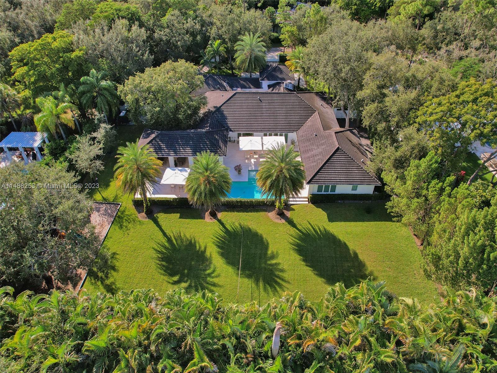 Stunning and immaculate one story home in exclusive North Pinecrest. Features 5 Beds/6.5 Baths plus den/office, or 6th bedroom. Complete Renovation inside & out. Cozy Living Room w/ Fireplace & formal living & dining area overlooking resort style pool, outdoor kitchen & expansive backyard. Open Flow thru floor plan is perfect for Entertaining. Casual breakfast area open to separate Family Room. Elegant Master Suite w/ Spa Bath, Large Walk in Closet & gorgeous Pool View. Marble & Wood floors throughout, top of the line Appliances & Large Kitchen Island. Other Features include Generator that powers whole house, tankless water heater, Natural Gas & Floor to Ceiling Impact Windows & Doors. No detail has been overlooked. Dead End Private Street, close proximity to top schools. Truly a Must see!