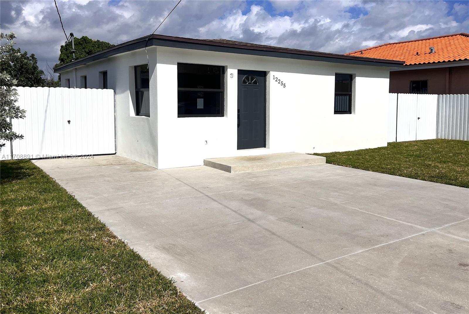 Totally redone. New, New, New, down to the concrete blocks!  New drywall, windows, kitchen, bath, A/C electrical, all new.  Be the first to live in this three bedroom one bathroom home with an extra large yard.  Windows are impact so you are worry free during a storm.  The plenty of parking spaces.  The appliance will be installed once under contract.  A terrace roof is also being installed for outdoor entertaining. Lawn service is included with the rent.
