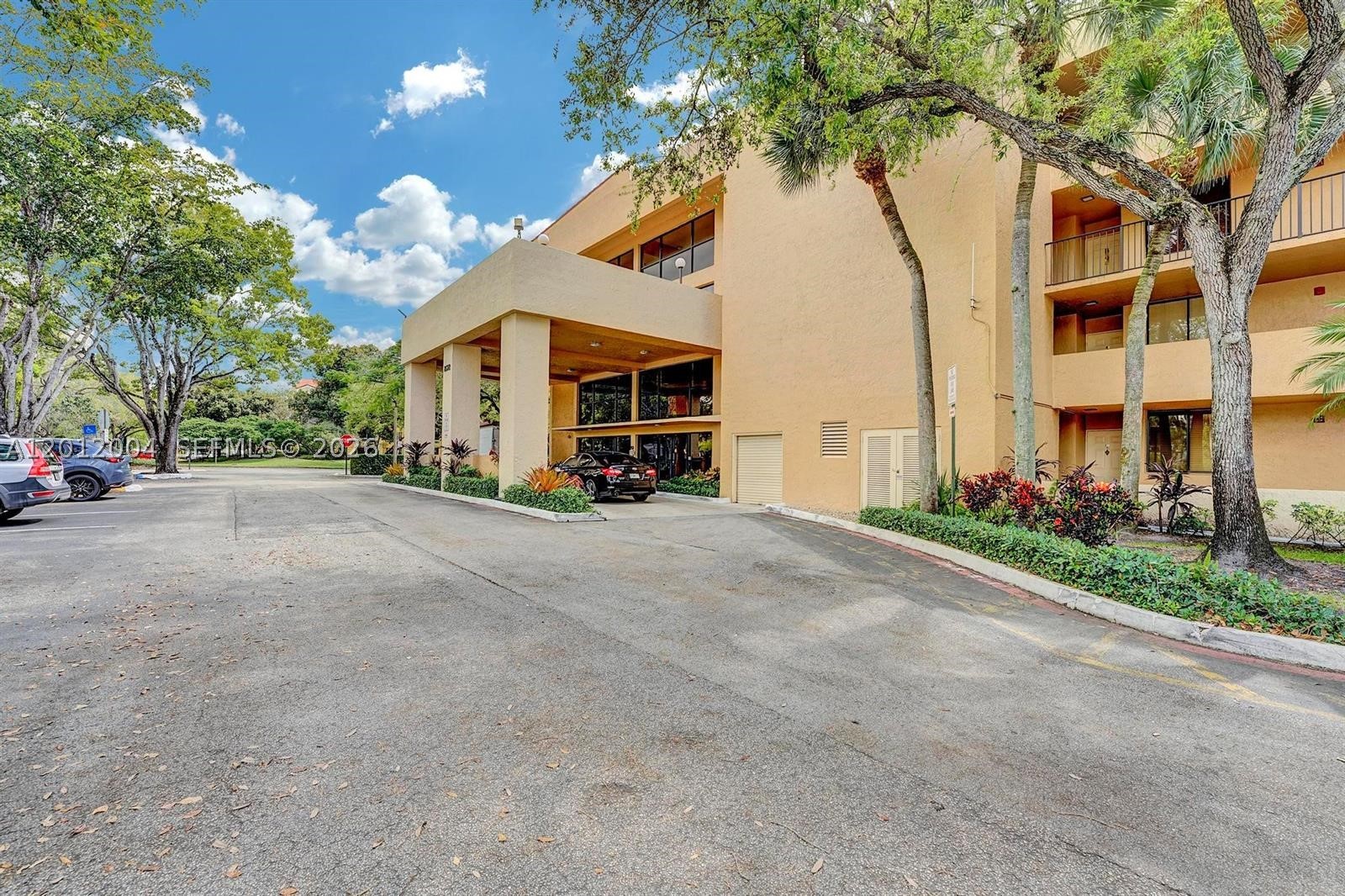 Welcome to the peaceful community of JACARANDA HEIGHTS in the heart of Plantation. This spacious condo offers over 1,000 sq ft of comfortable living, featuring a split layout with tile and laminate flooring throughout with ample natural light. 2 Generous Bedrooms with closets. 2 Full Bathrooms. Large, screened balcony perfect for relaxing with serene garden and lake views.  Washer and Dryer located conveniently in unit. Community has a Relaxing Clubhouse with Community Pool Well maintained common areas. Unbeatable Location Situated on Sunrise Blvd, nestled between Pine Island Rd and University Dr. You are minutes away from Plantation Walk, Broward Mall, endless dining, top rated schools, and parks. Easy access to major expressways (I-595/Turnpike). Perfect for First time homebuyers, downsizers, or a second home in sunny South Florida. Priced to Sell, Contact your broker today!
