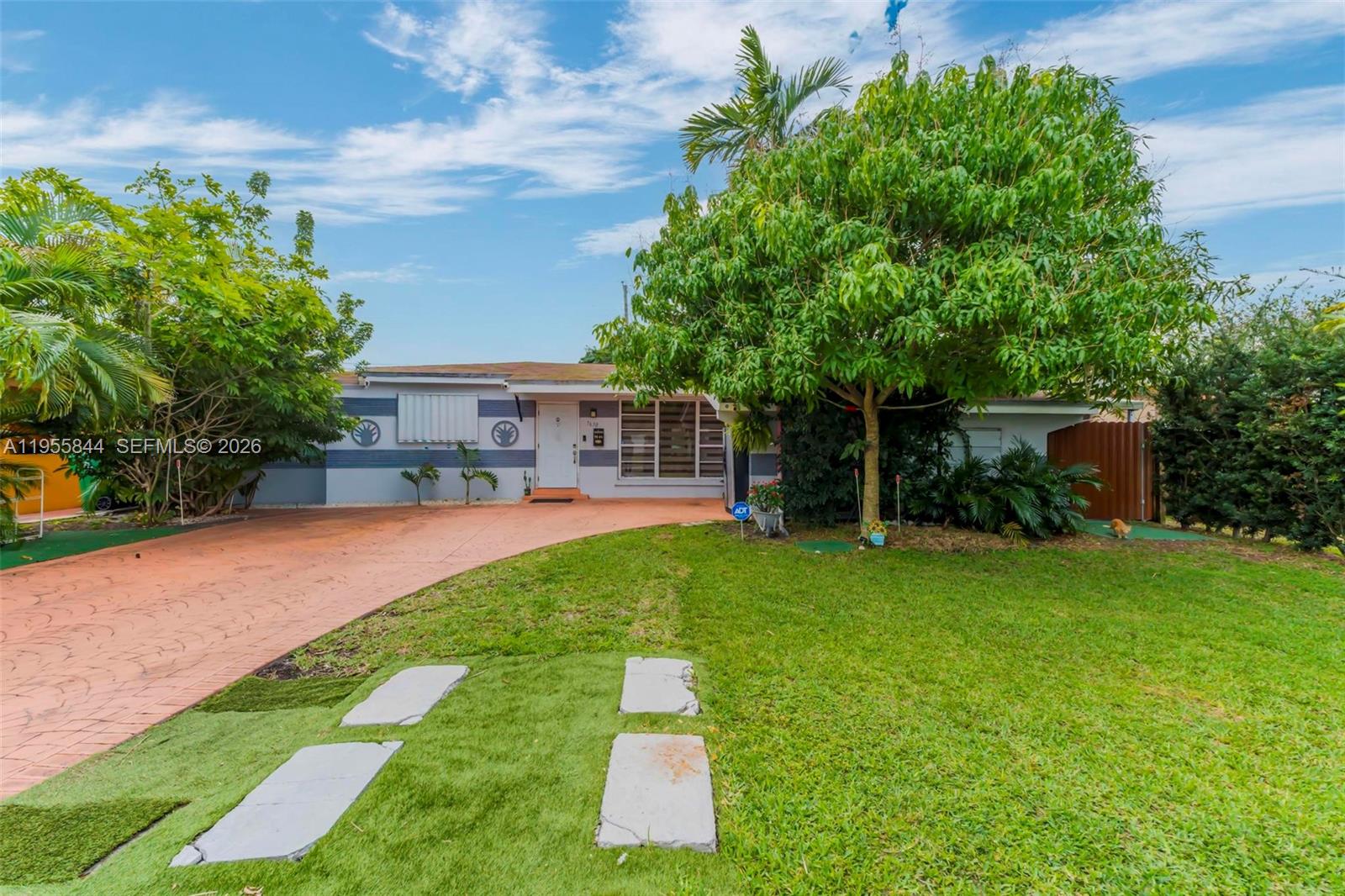 Exceptional opportunity for investors or large/multi-generational households—no HOA and a truly unique, highly functional layout. This 5-bedroom, 4-bath single-family home offers an extremely split floor plan, with nearly every bedroom featuring its own private entrance and en-suite bathroom, providing maximum privacy and flexibility. The home has been fully updated with new flooring and modern finishes throughout.
Step outside to a private backyard oasis, complete with a full outdoor kitchen, grill, and guest bathroom—perfect for entertaining or extended stays. The garage has been converted into a separate guest house, adding additional income or living potential. Additional highlights include a spacious front yard, extended driveway accommodating up to six vehicles plus a carport, and hurricane panels for all windows and doors. Gas service for the stove, water heater, and dryer adds efficiency and convenience. Ideally located just minutes from the Turnpike, offering easy access for commuters. This one-of-a-kind layout is truly a must-see to appreciate.