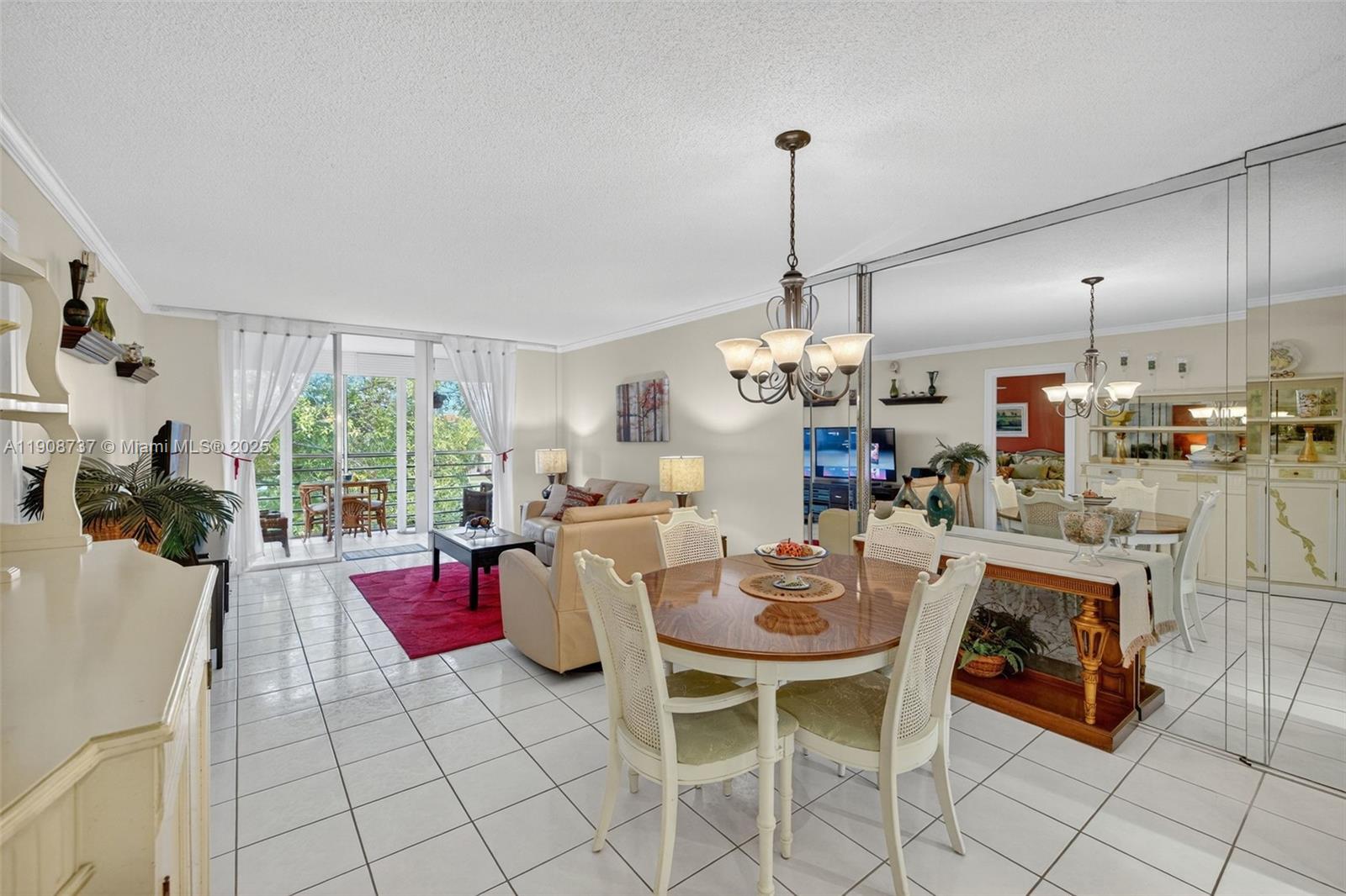 Immaculate turnkey 2-bedroom, 2-bathroom top-floor condo in the desirable community of Cypress Chase. This beautifully maintained & fully furnished home features a spacious open-concept living & dining area that flows seamlessly onto a screened-in balcony overlooking the serene garden and pool — Recent updates include new flooring, new vanities and mirrors in both bathrooms, a new water heater, & fresh interior paint. The building includes an elevator & convenient laundry facilities on each floor. Enjoy resort-style amenities such as a heated pool, hot tub, sauna, clubhouse with billiards and library, shuffleboard, picnic and BBQ areas, and beautifully landscaped grounds. Close to shopping, dining, and entertainment. A must-see turnkey home ready for its new owner!
