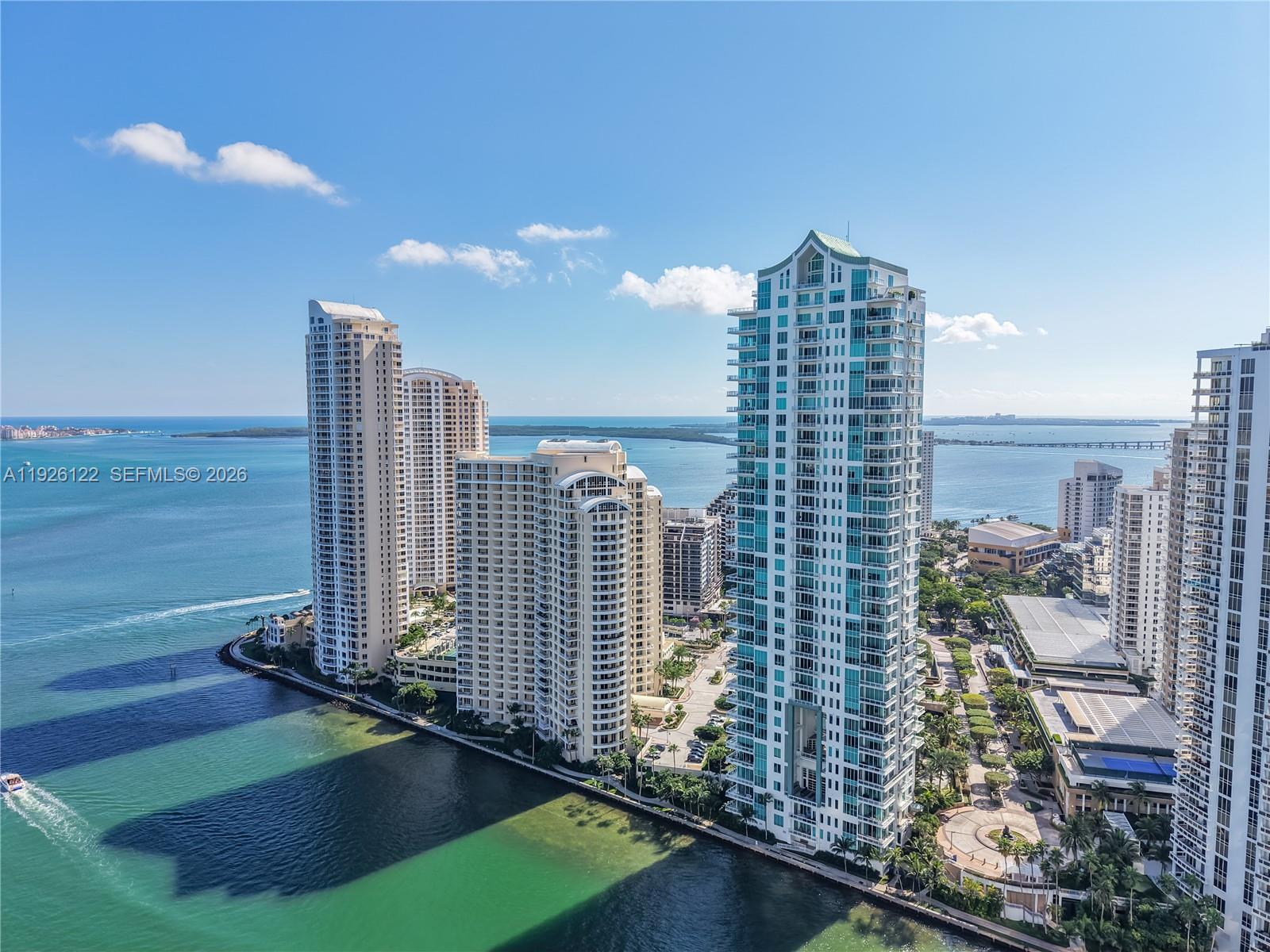 Stunning Corner Unit in Exclusive Brickell Key Luxury Building. Step into unparalleled luxury with this breathtaking 2-bedroom, 2.5-bathroom corner unit, plus den, located in one of Brickell Key’s premier buildings. Accessed via private elevator and vestibule, this residence offers ultimate privacy and sophistication. Boasting soaring 12-foot ceilings, the space is flooded with natural light and features top-of-the-line finishes, including Miele and SubZero appliances, electric blinds, and recessed lighting throughout. Enjoy the spacious wraparound balcony with panoramic views of Biscayne Bay, the Port of Miami, and beyond—perfect for outdoor relaxation or entertaining. The unit also comes with private storage conveniently located on the same floor. Residents have access to a wealth of exceptional amenities, including tennis, basketball, and racquetball courts, a resort-style pool, 24/7 valet service, and concierge. This is truly luxury living at its finest in one of Miami's most coveted neighborhoods.
