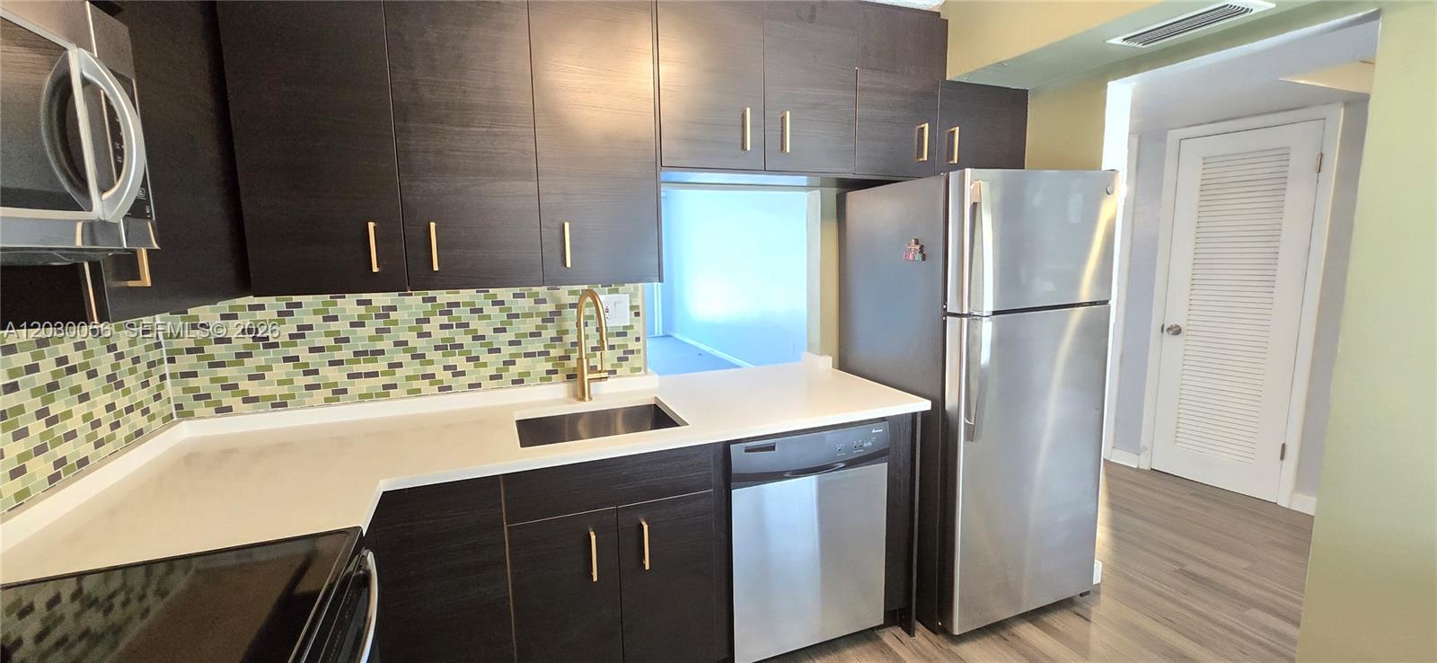 **Impact windows and slider thru-out this beautifully done 1 bed 1.5 bath condo facing the pool and the new community of Greenview at Presidential Estates in an area some call Aventura West. Redone Kitchen with new quartz countertop and new fixtures. Newly tiled bathrooms and new vanity lights. Newer AC and 3 closets, one is a Large walk-in closet. This condo's great location makes it the perfect place to call home. Community offers a pool. Centrally located, close to Aventura and Freeway access