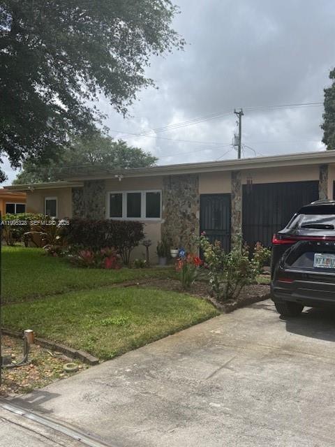 Drastically reduced.  Beautiful 4 bedrooms 1 bathroom with enclosed garage, Impact windows. Ready to move in. Tastefully updated bathrooms, kitchen and floors. Great layout both for gatherings and privacy. Covered patio is a great place to relax and enjoy your morning or afternoons Centrally located with shopping centers, main roads and highways. with a nice size yard ALL FENCED.