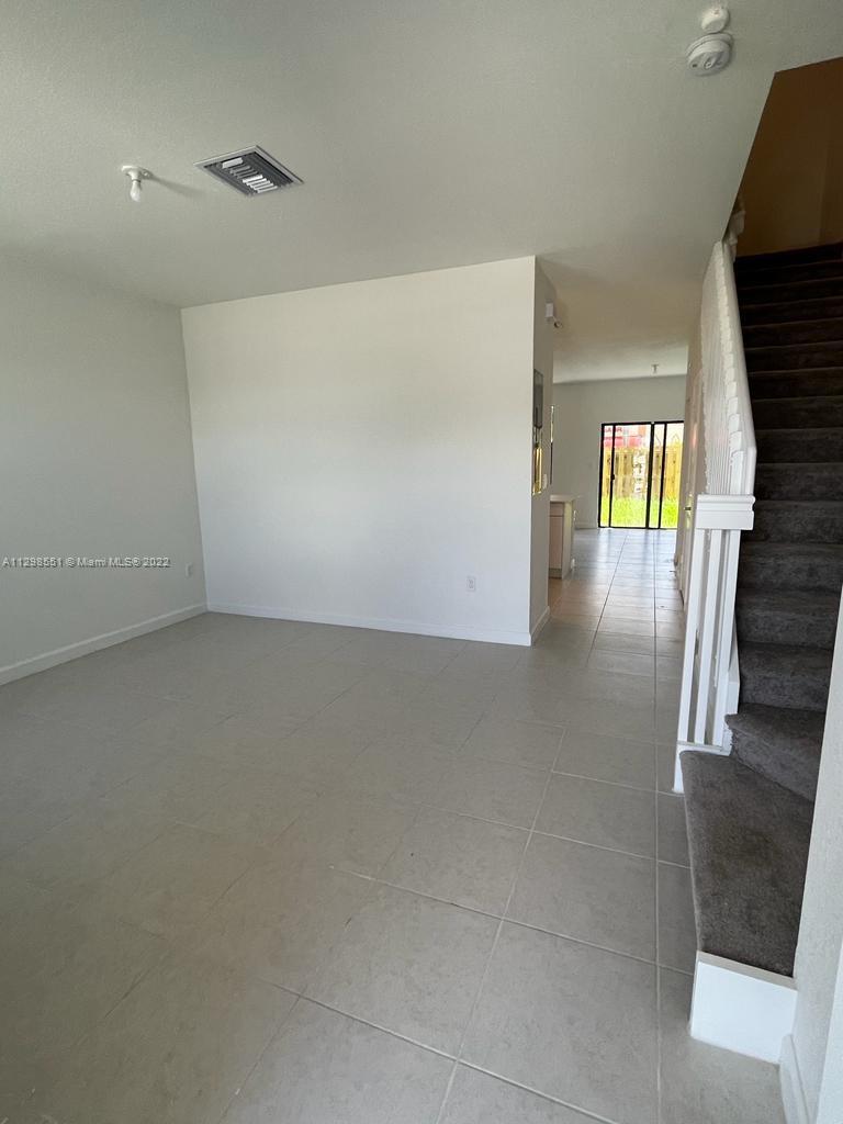 New Townhouse at Pine Vista! 3 Beds / 2.5 Baths. "CASIS" model with tile floor downstairs and carpet floor upstairs. Modern kitchen with stainless steel appliances. Nice backyard to enjoy outdoors and BBQs. Laundry on 1st floor. Clubhouse will have a playground and swimming pool. Near to Homestead's best schools, with easy access to Florida Turnpike Expressway. Walking distance to shops and restaurants.