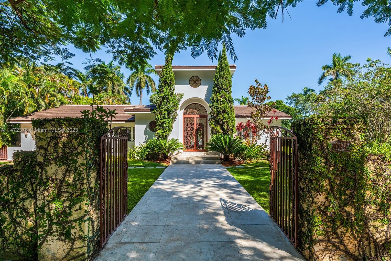 Situated in the heart of Coral Gables, this single-story, gated residence sits on 3 lots totaling 25,800 sq ft, a rarity.A grand foyer welcomes you with abundant natural light, leading to a spacious living area featuring high ceilings and a marble fireplace.The house includes a formal dining, expansive kitchen, and a generously sized family room perfect for hosting gatherings.A massive primary suite + 4 bedrooms, each has an accompanying bath.  With a split bedroom layout, a new roof, refinished wood floors, a covered patio terrace, and a laundry room, it offers both elegance and functionality. The property's lot may allow for the addition of a North/South tennis or pickleball court. Enjoy the ultimate in living with proximity to top-notch shopping, dining, entertainment, golf and schools.