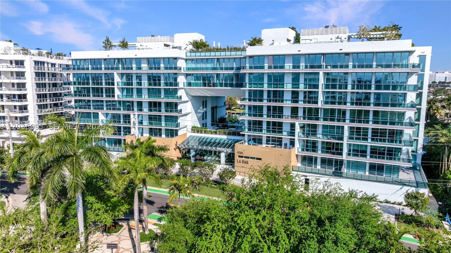 Step into the pinnacle of luxury living with this brand-new, never-lived-in masterpiece at La Baia South. This sprawling 2,068 sq. ft. corner residence offers 3 BR's + den, 3.5 baths & breathtaking double exposures w/ glittering city views.

From the moment you enter, you're greeted by an abundance of natural light pouring thru oversized, soundproof hurricane impact windows, creating a serene & private escape. The sleek, modern interior features stunning wood flrs & an open-concept layout that flows effortlessly through the double living / dining, and entertaining areas. At the heart of the home, the chef’s kitchen dazzles with premium Miele appliances, a spacious island, breakfast bar, butler’s pantry, laundry room and impeccable top-tier finishes.

Step outside to your private wraparound terraces—a haven for relaxation or entertaining—where you'll soak in panoramic views of the city skyline. To top it off, this residence includes a storage unit and 2 parking spaces.

La Baia South is a haven of world-class amenities designed to elevate your lifestyle. Enjoy a lounge/party room, a state-of-the-art fitness center, a breezeway for outdoor yoga & meditation & the convenience of F/T concierge & doorman services. Unwind in the rooftop heated pool & hot tub, and savor the lush common outdoor spaces, including a garden, two BBQ areas, children's splash area and more!.
