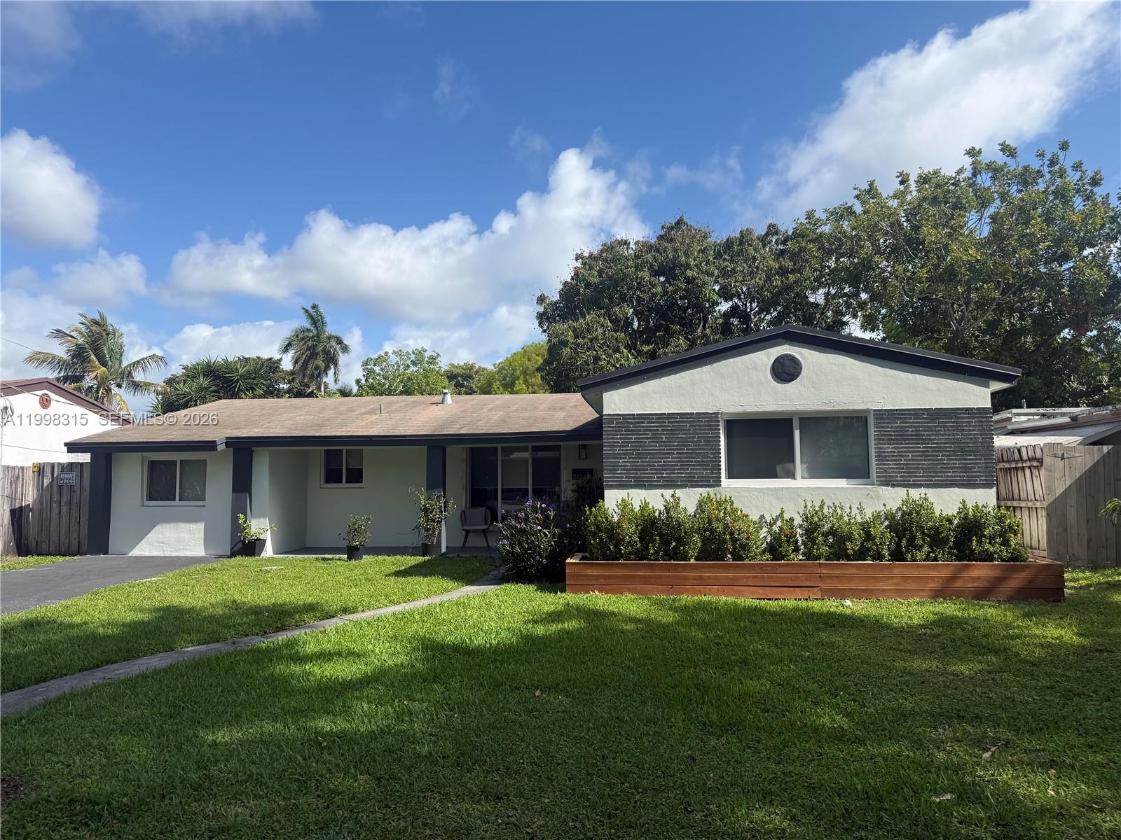 Discover paradise living in this meticulously renovated 3/2 single-family oasis nestled in Hollywood's sought-after Lakeview Estates! Enjoy vaulted ceilings and abundant natural light in an open floor plan. Your private ocean access canal provides tranquility and exclusive waterfront views, with the added luxury of docking your own boat right in your backyard for the ultimate South Florida lifestyle. Bathrooms feature floor-to-ceiling tiles and glass enclosures. The stunning open-concept kitchen features quartz countertops and top-of-the-line appliances, perfect for everyday living and entertaining. Impact windows and doors have been newly installed throughout, enhancing safety and significantly reducing insurance costs. Step outside to a beautifully enhanced exterior featuring newly added astro turf and paver walkways along the sides of the home and around the shed area, creating clean, low-maintenance spaces perfect for storage access and everyday convenience. Experience modern comfort and style in every corner. A rare opportunity to own a move-in-ready waterfront home that truly captures the best of South Florida living!