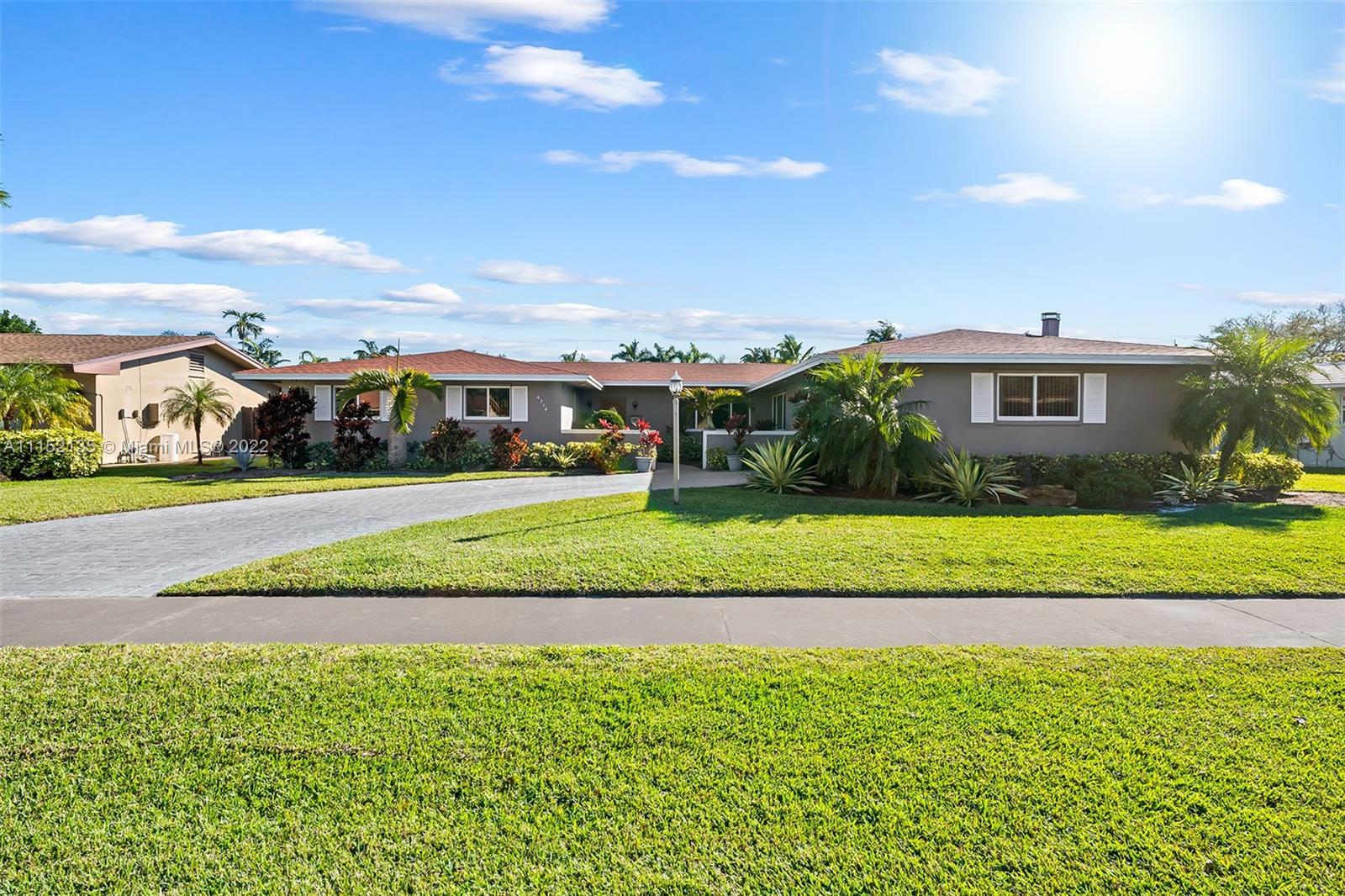 Rare opportunity to purchase an absolute gem located in the Estates Section of Hollywood Hills! This home boasts over 2,800 SqFt under air and sits on a 13,000+ SqFt lot! This property has an amazing floor plan and features 4 bedrooms, 3 bathrooms and a cozy den with a brick fireplace and exposed wood beam ceiling that could be used as a family room, office or guest suite! The backyard has an abundance of space and features a large swimming pool making it perfect for entertaining or family time! This home is equipped with impact windows and doors and has a newer roof that is only 3-4 years old! Large eat in kitchen has great space for a home chef! Amazing location between Miami and Fort Lauderdale and proximate to the beach, I-95, airport, hospitals, great schools, and places of worship.
