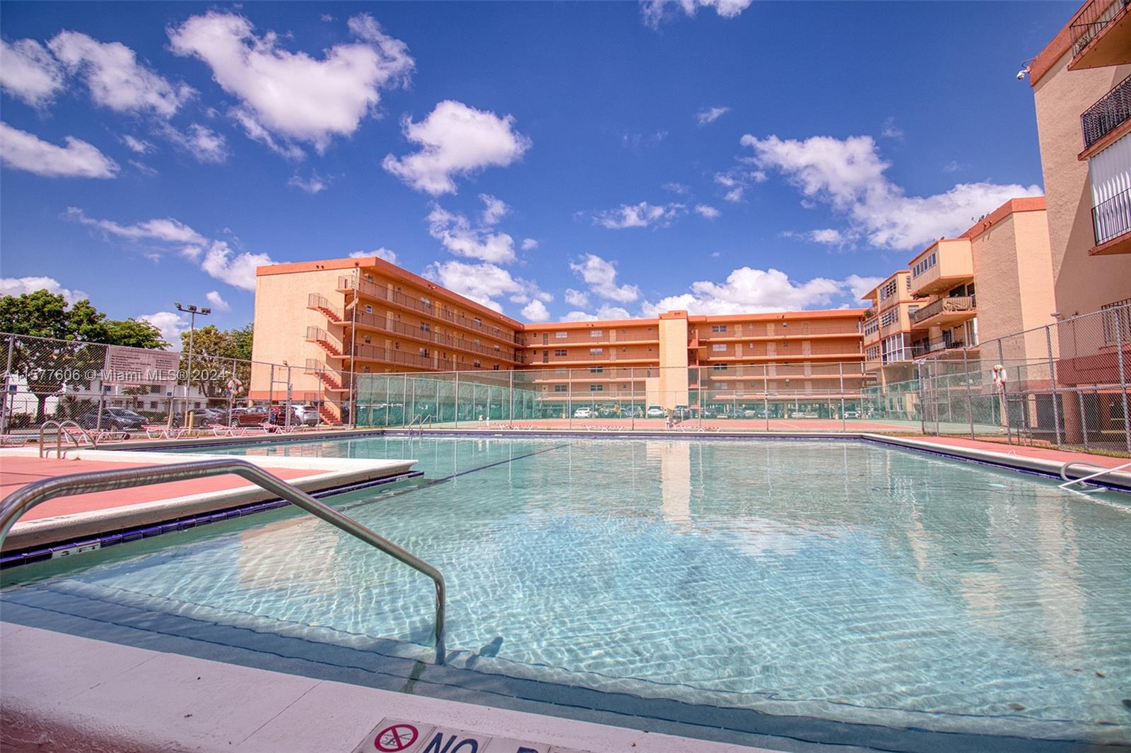 Beautifully updated and spacious unit in the heart of Hialeah with an open floor plan. Kitchen has granite counter tops overlooking the dining and living room. This apartment also has a balcony with beautiful glass doors leading to it. The master bedroom has a walk in closet as well as sliding doors leading to the enclosed balcony. Bathroom is large and comfortable with tons of storage space. The building is gated and has card entry and features a beautiful pool, tennis court, and club area. Parking is assigned and covered.