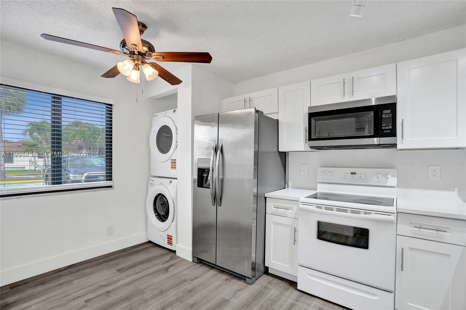 Beautiful updated 2 bedroom 2 bathroom condo with all new appliances and move in ready!  It is well-maintained and thoughtfully updated residence located in the heart of North Lauderdale. The home features custom closet organizers in both the primary and secondary bedrooms, offering exceptional storage and organization. The property is equipped with brand-new appliances, including a refrigerator, dishwasher, washer, and dryer for added convenience.

Recent upgrades include a new central A/C system, new air handler, and professionally cleaned ductwork, ensuring optimal comfort and efficiency. Both bathrooms have been fully renovated with modern finishes and elegant glass shower doors.

Enjoy stylish, waterproof luxury vinyl flooring throughout—completely free of tile and carpet—for a clean, contemporary look. Additional highlights include hurricane impact windows, new blinds, and a freshly painted interior. This inviting home offers a comfortable and functional layout, enhanced by modern upgrades and stylish finishes throughout. Enjoy a bright and airy living space, complemented by updated flooring, renovated bathrooms, and a refreshed interior that creates a move-in-ready experience. Conveniently situated near shopping, dining, and major roadways, this property blends everyday convenience with a relaxed South Florida lifestyle—perfect for homeowners or investors alike