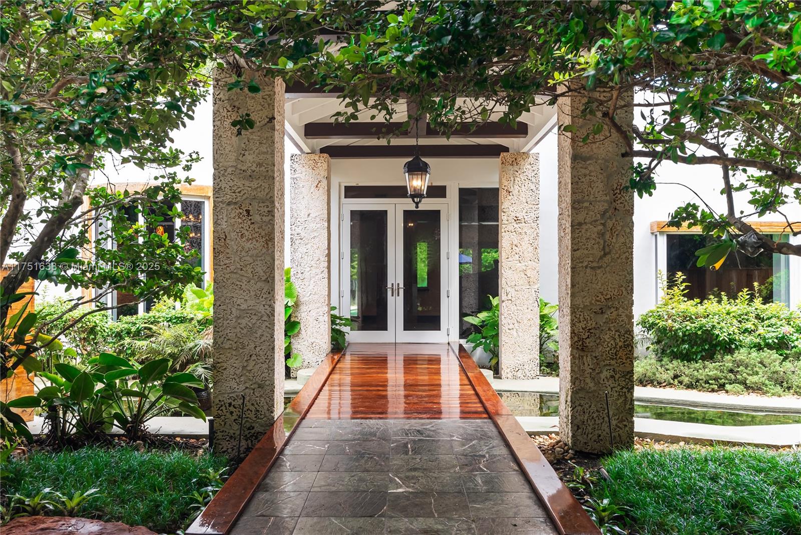 Nestled on a secluded street, the moment you pass through the gate, you'll feel transported to an enchanted oasis. Set on a sprawling 1.22-acre lot, this home is surrounded by lush tropical landscaping that evokes the serene beauty of Tulum. The peaceful sound of a cascading waterfall welcomes you, leading to a tranquil fish pond teeming with vibrant orange fish.
This mid-century modern home is truly one of a kind. Completely remodeled in 2014.
The great split floor plan features a master suite on one side & 3 bedrooms in the opposite wing, plus a lg office with fireplace.
The spectacular outdoor space offers a lighted tennis court, pool & separate 1/1 guest house w sauna.
Seller is motivated Don’t miss this opportunity to own a private retreat unlike anything else on the market today.