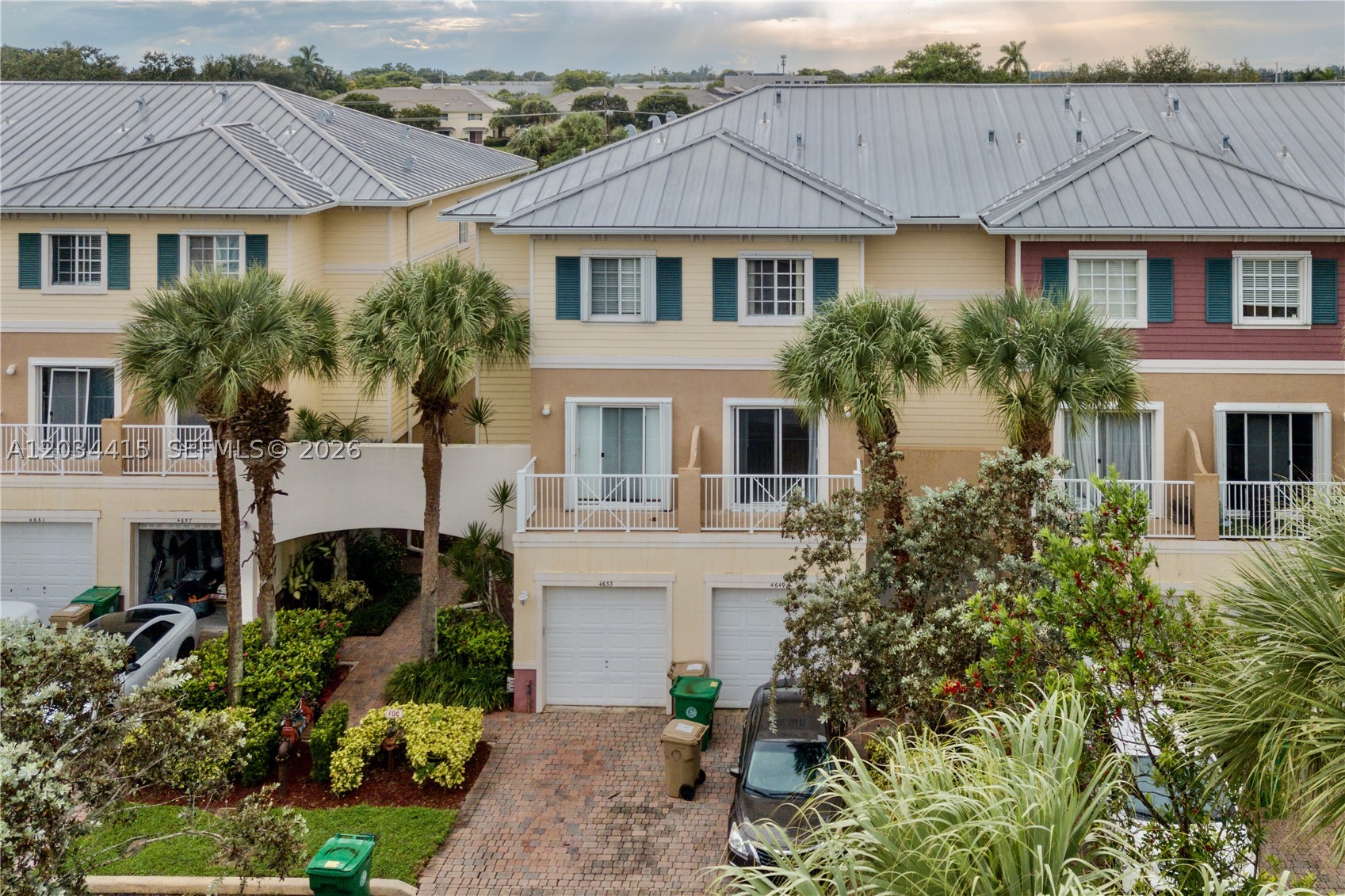 Beautifully updated 3-story townhouse offering spacious living, modern finishes, and canal/garden views. The first floor welcomes you with an open-concept kitchen, dining, and living area, a convenient half bath, and French doors leading to a private patio overlooking the canal and garden. The updated kitchen features wood cabinetry, quartz countertops, and stainless-steel appliances.

The second floor offers a generous primary suite with a private balcony, two walk-in closets, and a large bathroom featuring dual sinks, a Jacuzzi tub, and a separate water closet. The third floor includes a laundry room with washer/dryer and two additional bedrooms, each with walk-in closets.

Recent updates include brand-new vinyl flooring throughout where carpet was previously installed and fresh interior paint throughout the entire home. A one-car garage adds extra convenience. Spacious, bright, and move-in ready!
