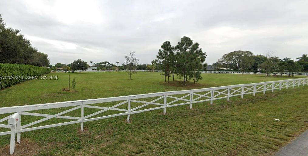 Rare opportunity to own a sprawling 188,179.2 SF corner lot in the heart of Miami's highly desirable Horse
Country. Ideally located along SW 125 Avenue between Miller Road and Sunset Drive, this prime parcel is
surrounded by multimillion-dollar estates and some of the area's top equestrian facilities. Lots of this size in such a prestigious and established neighborhood are extremely limited, making this a true standout opportunity. The
generous dimensions and corner positioning offer endless potential to build a custom luxury estate, private
equestrian compound, or legacy property tailored to your vision. Enjoy the perfect blend of privacy and
convenience — just minutes from top schools, shoppings, dining, and major roadways — while being nestled in
one of Miami’s most sought-after residential pockets. A one of a kind offering in a location where large parcels are increasingly hard to find.