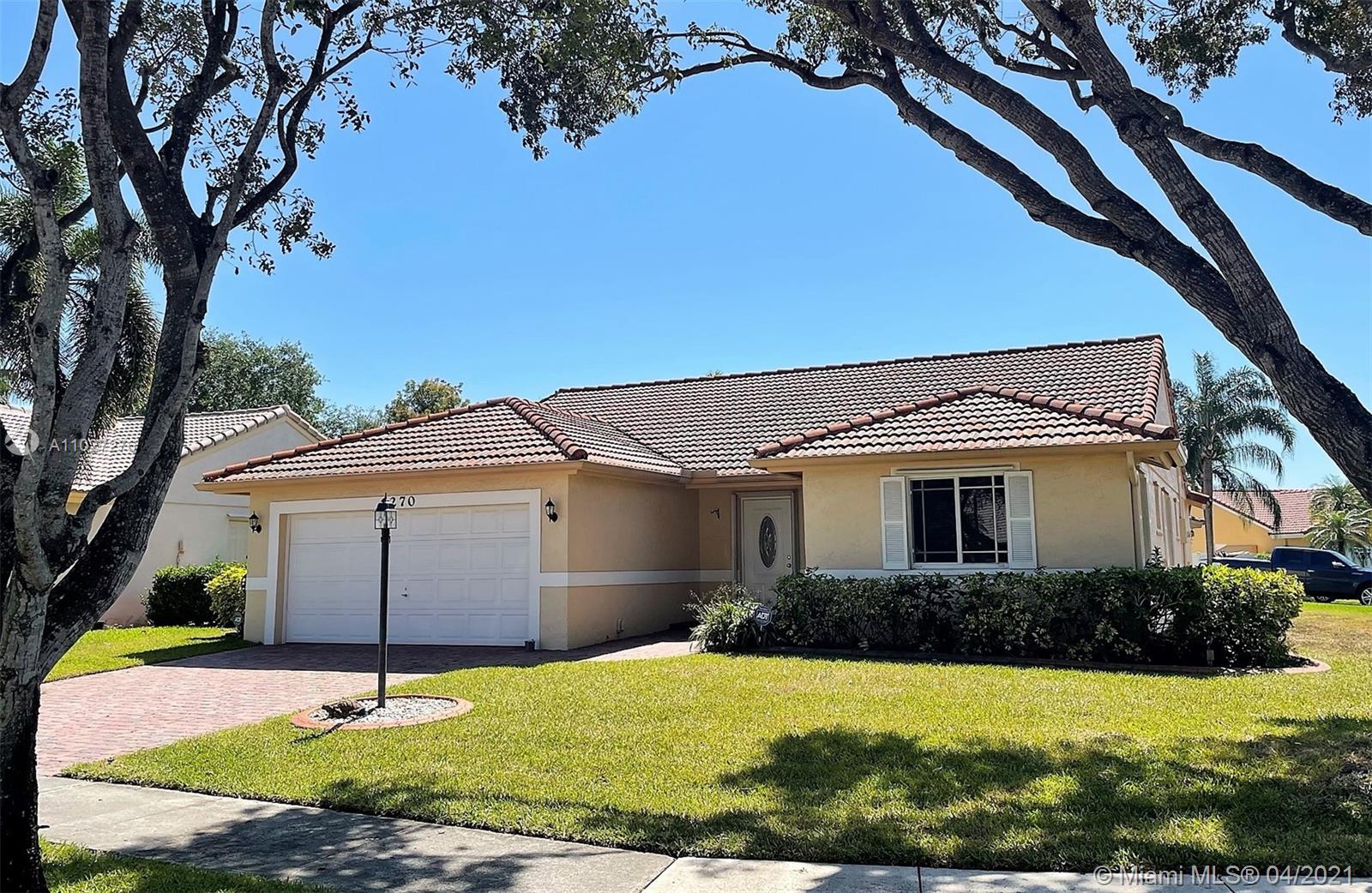 Highly sought after 3 bedroom / 2 bathroom / 2 car garage home in the coveted Waverly Hundred community. A rated schools. Spacious open floor plan with high ceilings and tile floors throughout the kitchen and main living areas. Oversized master bedroom with ample closet space and beautiful master bathroom with walk-in shower. Second bathroom offers a shower/tub combination. Ceiling fans and window treatments in every room. Two-car garage with side door access & laundry area. Hurricane windows and shutters. West facing front yard is shaded by three mature trees and a brick paved driveway for ample parking. Covered screen patio in the backyard with an oversized lot and side cul-de-sac. Prime location in Davie close to great schools, I-75, Lowes, Publix, Costco & more! GO SHOW! On Supra