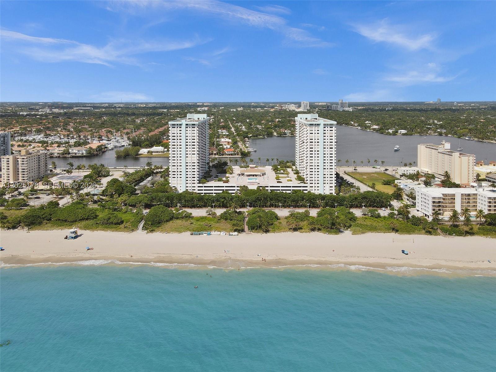 OCEAN VIEWS! 40 YR BUILDING CERTIFICATION COMPLETED! HAS RESERVES! NO SPECIAL ASSESSMENTS! IN-UNIT Washer and Dryer! UPDATED condo with ocean and pool views! Features wood laminate flooring throughout the living areas and bedrooms. The kitchen features granite countertops and ample cabinet space—primary bedroom with a walk-in closet and en-suite bathroom with a walk-in shower. Den can be converted to a 2nd bedroom! The building offers a heated pool, exercise room, tennis, pickleball, basketball, sauna, and community room. CENTRALLY located near Hollywood Beach Boardwalk with shopping and restaurants!