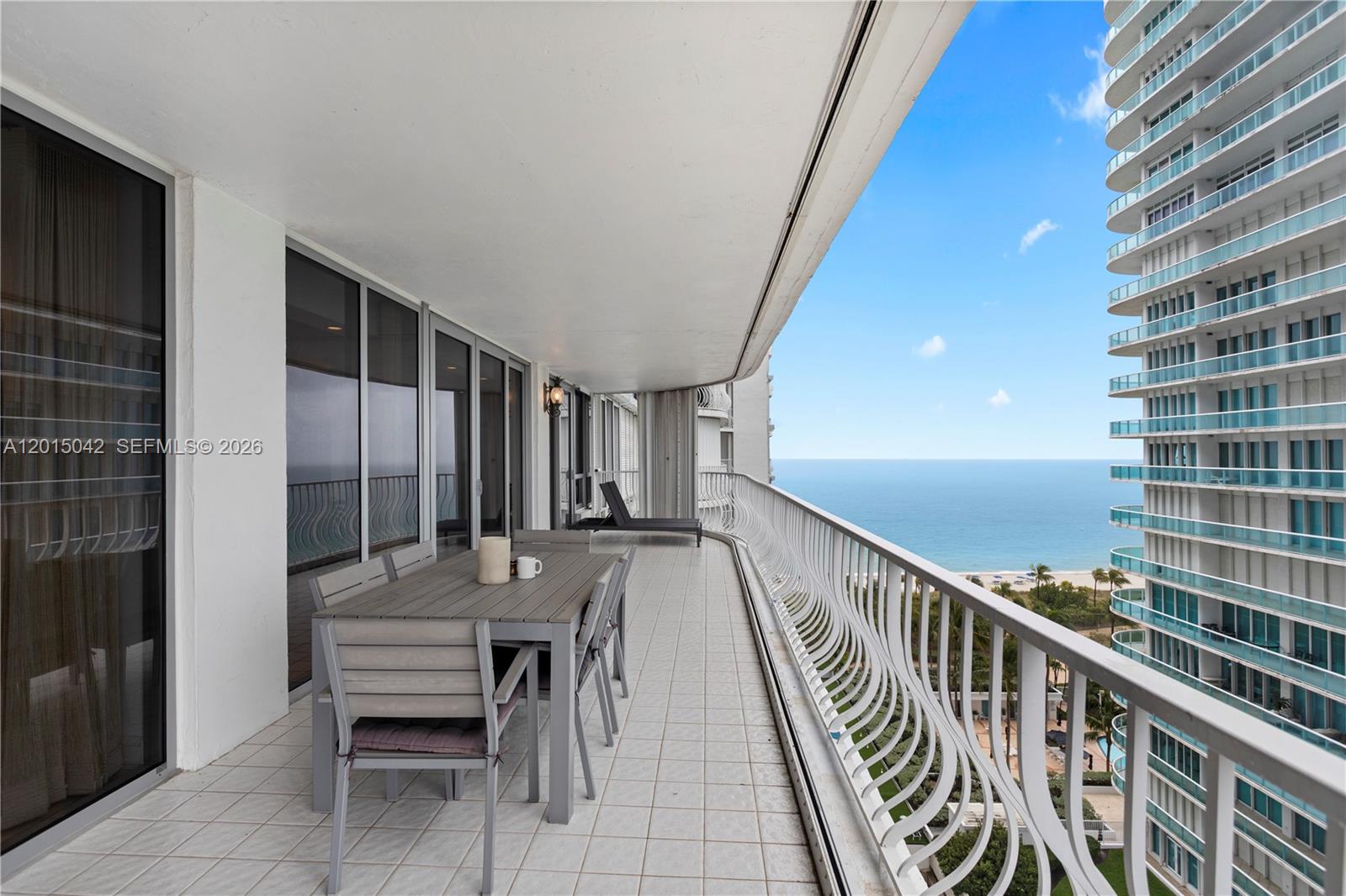 This stunning 3,340 square foot residence is the largest unit of its line in the prestigious Bal Harbour 101. Renovated to the highest standards, it boasts sweeping panoramic views of the Atlantic Ocean and the glittering Miami skyline.The expansive, open-concept living spaces feature a gourmet kitchen with a large granite island, a dedicated laundry room with walk-in pantry, and a versatile office/study that easily converts to a third bedroom. Adjacent is a spacious family room/den, perfect for relaxation or entertaining. The lavish primary suite is a true retreat, complete with separate his-and-her bathrooms, two oversized custom walk-in closets. Bal Harbour 101 offers the ultimate in beachfront luxury with its recent full-building renovation and world-class amenities