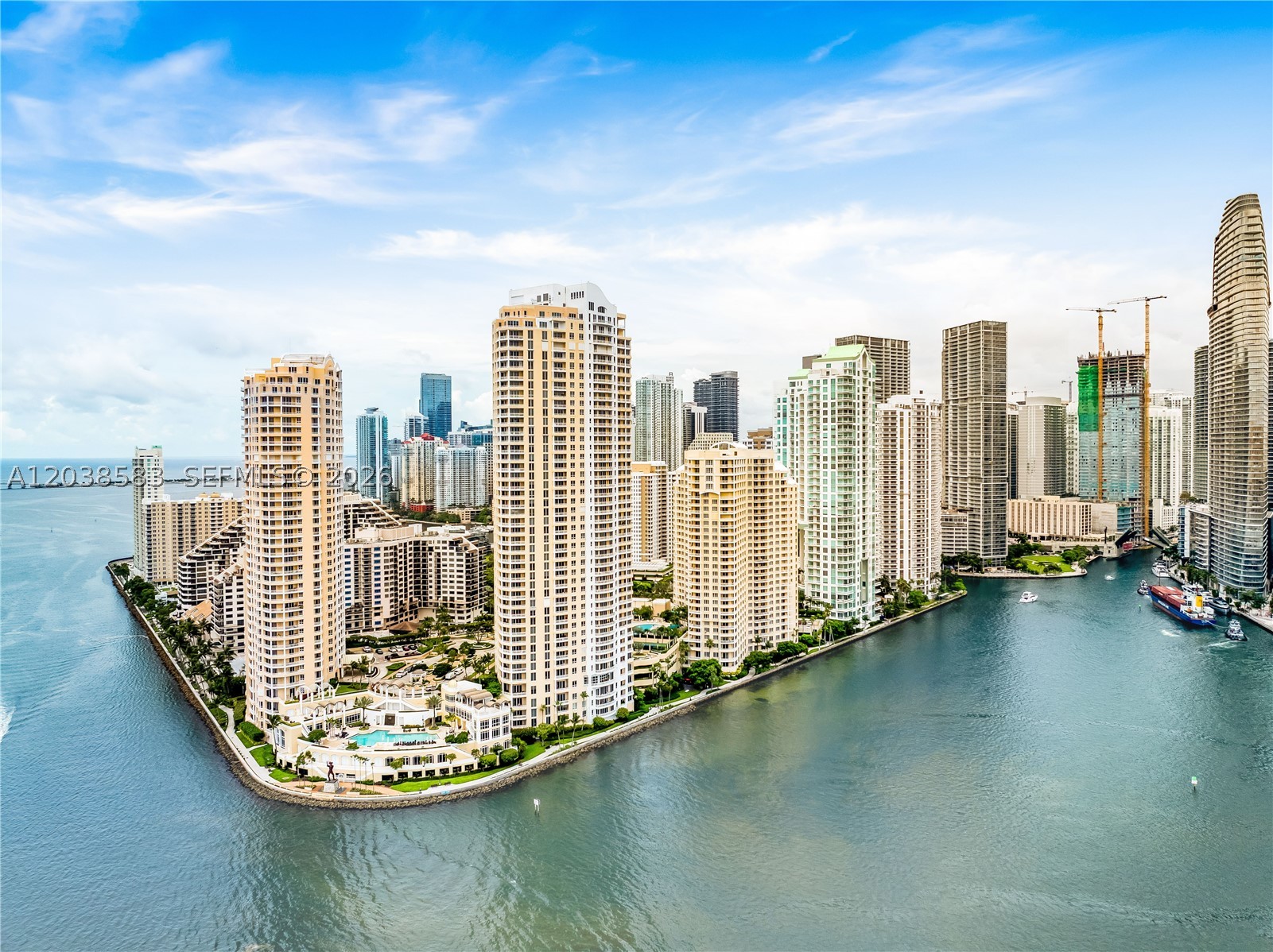 Experience the best of waterfront living at One Tequesta Point. Pristine 2BR/2BA residence featuring unobstructed Brickell Bay views from every room and three private balconies. Split-bedroom floor plan with one assigned parking space. Primary with 2 vanities and walk in shower. Guard-gated building with full-service amenities including 24-hour concierge, valet, fitness center, sauna, social room, and business center. Enjoy island living on Brickell Key, steps from restaurants, grocery stores, and a playground