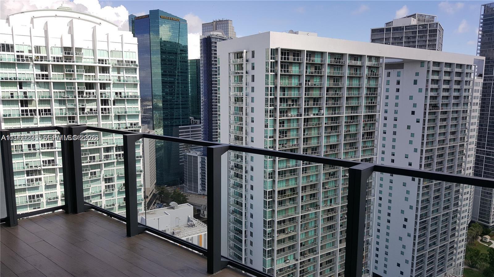 Spectacular High-Floor Unit with Unobstructed Ocean and City Views. Experience breathtaking, panoramic views of both the city skyline and the Atlantic Ocean from this stunning high-floor residence. Fully renovated and tastefully furnished, this unit boasts a sleek open kitchen, modern designer bathrooms, and expansive walk-in closets. Enjoy sunrise and sunset vistas from both bedrooms, each offering floor-to-ceiling windows that frame the views beautifully. Located in a premier five-star resort-style community, residents enjoy world-class amenities including a tennis court, expansive pool, state-of-the-art gym, full-service spa, poolside café, and direct beach access. A true luxury lifestyle awaits.
