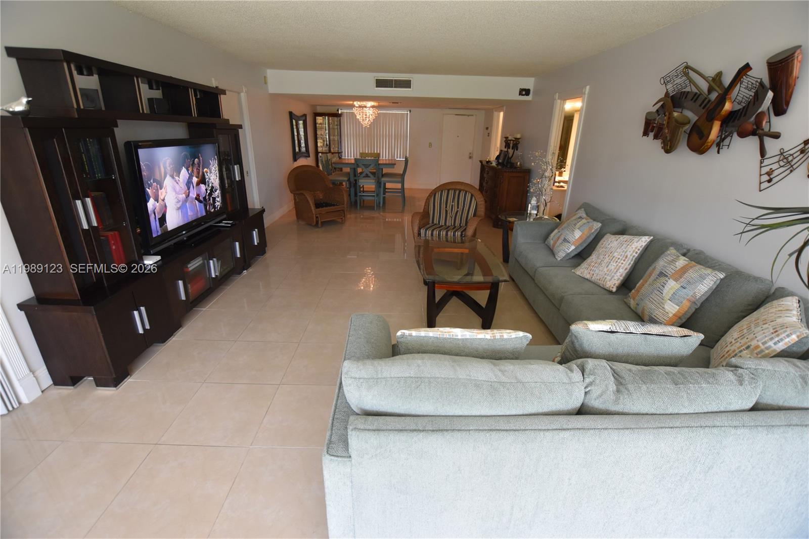 This move-in ready 3/2 split floorplan offers gorgeous views of the golf course from a stunning screened-in balcony, perfect for relaxing any time of day. Both bathrooms have been updated, and the home boasts stainless steel appliances, a Nest thermostat, walk-in closets, and a stackable washer and dryer. The community features two pools, a sauna, sand volleyball, pickleball, basketball, tennis, and a gym. Just ten minutes from the beach and close to Topgolf, Publix, and Home Depot, with maintenance covering water, internet, and cable.