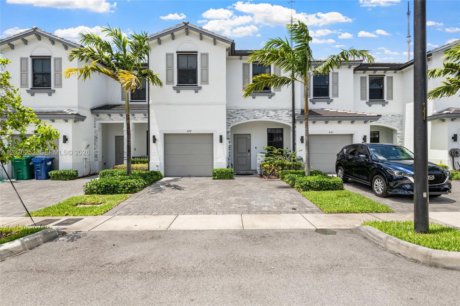 SAVE APPROX. $357/MONTH YOUR FIRST YEAR!* Ask about the FREE 1-0 interest rate buydown available through June 30th—an incredible opportunity to enjoy lower monthly payments on this beautifully upgraded, move-in-ready townhome.

Built in 2022, this stunning 4-bedroom, 2.5-bath townhome offers style, comfort, and serene lake views within a quiet gated community. Enjoy upgraded porcelain tile flooring downstairs, quality laminate flooring upstairs, spacious living areas, custom closets, and thoughtful upgrades throughout.

The redesigned backyard patio with modern cement pavers and turf accents creates the perfect low-maintenance space for entertaining or relaxing by the lake. Additional highlights include a Samsung washer and dryer, ample guest parking, and custom wall furniture valued at $7,000 available with a full asking-price offer.

Residents enjoy resort-style amenities including a pool, gym, clubhouse, and children’s play area. Conveniently located just 10 minutes from Hard Rock Stadium and under 5 miles from Aventura Mall with easy access to shopping, dining, and commuter routes.

A rare opportunity to own a stylish, upgraded lakeview townhome with upgrades already done for you—schedule your private showing today!

*Savings estimate based on temporary 1-0 buydown terms and buyer qualification.