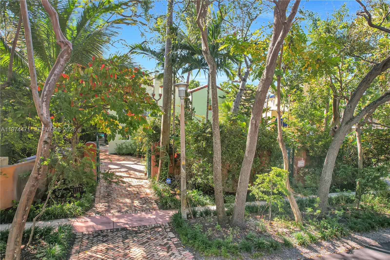 Inspired by early Miami Old Spanish architecture, this modern estate integrates the best of old-world soul with heavy-duty engineering. While public records state 1925, the estate functions as modern construction following massive ground-up structural reconstructions spanning 1999 to 2023. Perched 16ft above sea level in a preferred X Flood Zone (no insurance required), it features full impact glass, concrete-reinforced expansions, and 400-Amp industrial power. Total estate footprint includes 3,090 SF main home + detached multi-use guest cottage + climate-controlled garage w/ Tesla charger + expansive terrace equalling 4000 sq ft of living space. Meticulously updated (Roof 2018, HVACs 2023, Plumbing/Electric overhauled), the interior marries contemporary high-end finishes with historic warmth. Complete with a sparkling pool and lush, pesticide-free native gardens, this private Coconut Grove oasis is engineered to stand for another century. True reconstruction timeline available in attachments.