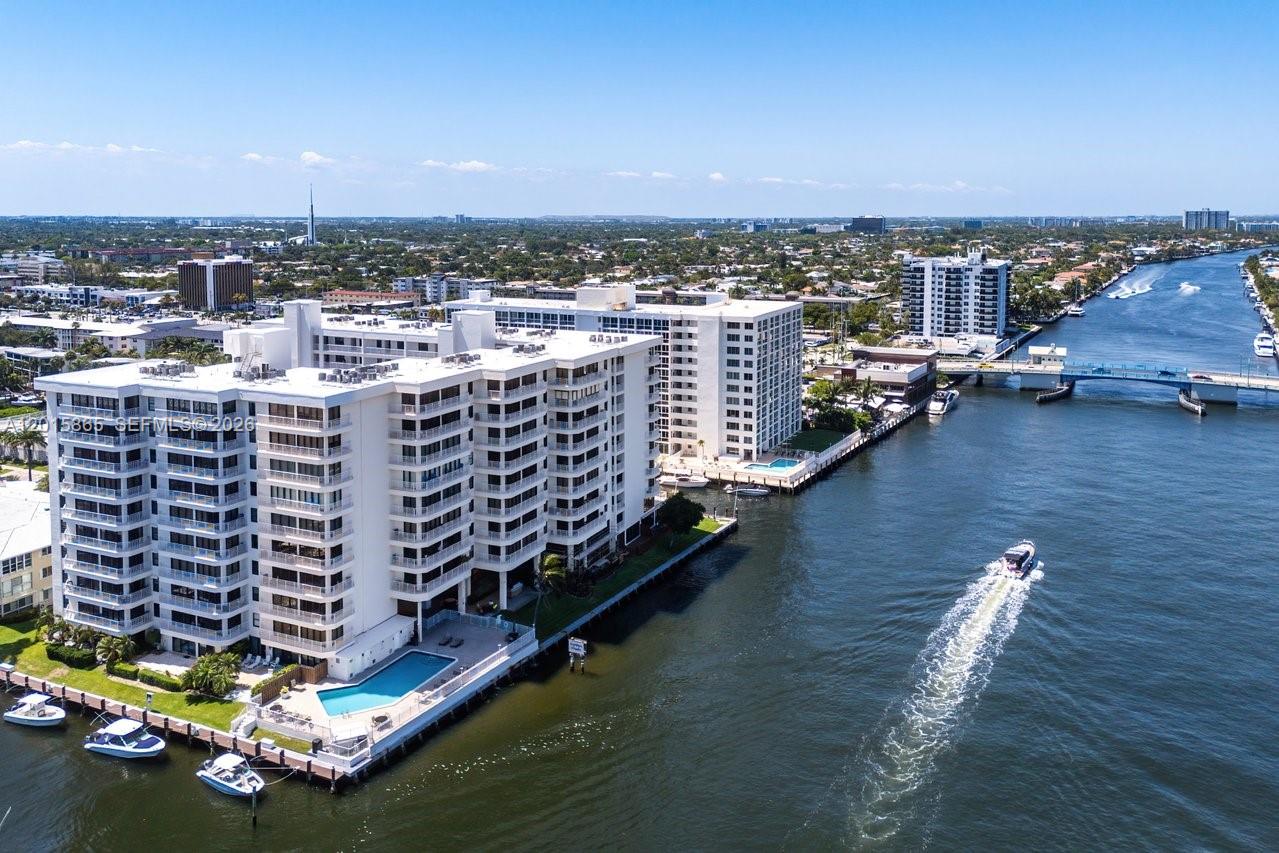 Luxury waterfront living at its finest. Dock your boat outside your apartment. Enter the home through a wide spacious balcony over looking the garden an water ponds. On the canal & intracoastal, Large 2-bedroom, 2-bathroom condominium with lots of natural light. Step outside to a long balcony that seamlessly connects the living room and bedroom, perfect for entertaining while enjoying the coastal water views. Additional highlight includes highly sought-after inside garage parking (upper #167). The Pilot House waterfront community in Coral Ridge Country Club Estates offers lobby security, fitness center, heated pool, barbeque area with outdoor dining, community lounge, pet friendly building, cable TV & Wi-Fi. Boat slip & jetski dock rentals when available. Ideally located just minutes from Lauderdale by The Sea, the beach, shops and local restuarants. Experience resort living at its finest. Images with furniture are virtually staged.
