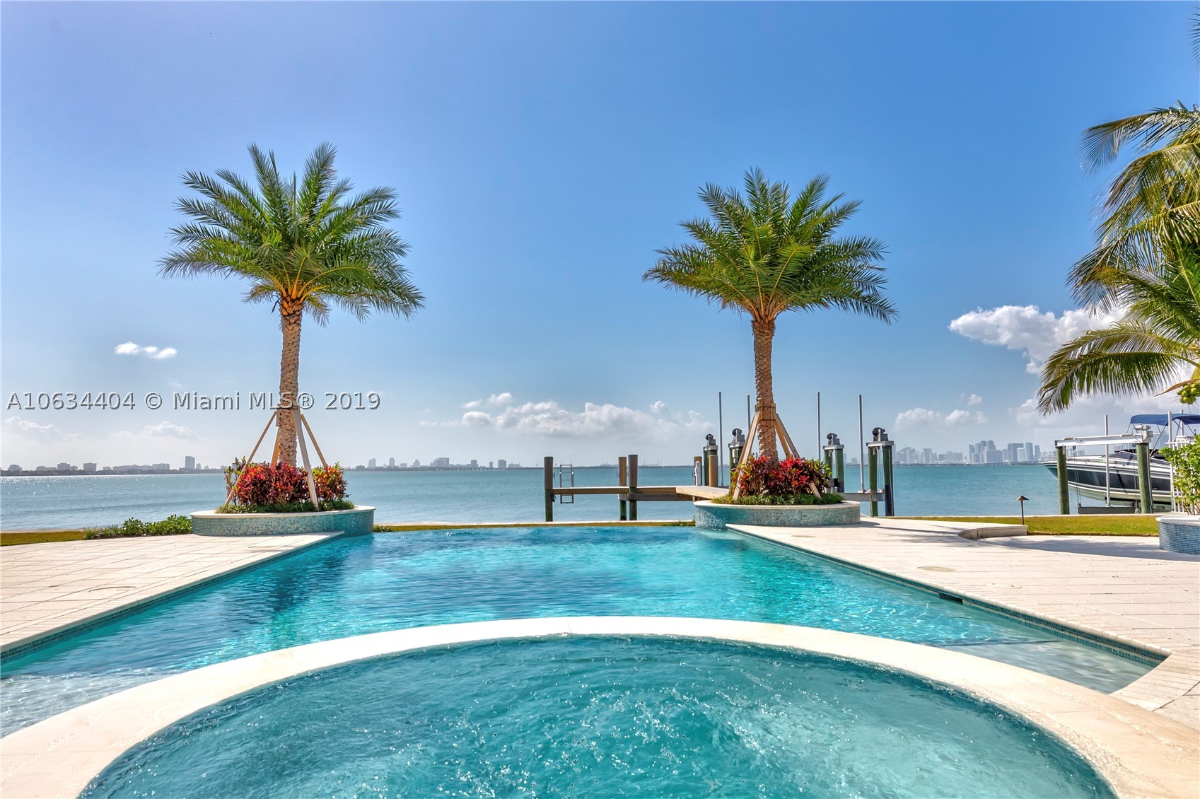 MODERN MASTERPIECE ON OPEN BAY OVERLOOKING MIAMI'S SKYLINE! THIS STUNNING 5 BED/5.5 BATH + MOVIE THEATER + MAID'S QUARTERS IS SITUATED ON A 15k SQ.FT. LOT FEATURING ENDLESS WATER & CITY VIEWS.  SOME OF THE FEATURES INCLUDE HURRICANE IMPACT WINDOWS AND DOORS, CRESTRON SMART HOME SYSTEM, WATER FILTRATION SYSTEM, CENTRAL VACUUM, BOAT DOCK WITH 40K-LB (high speed) BOAT LIFT,  SOLAR  POWERED, FULL HOUSE GENERATOR, 8K-LB CAR LIFT & 3 CAR GARAGE+ CAR LIFT. THE OUTDOOR OASIS FEATURES A SALT WATER HEATED INFINITY EDGE POOL WITH SPA,  SUMMER KITCHEN, FIRE PIT AND SUNSETS THAT WILL LEAVE YOU BREATHLESS. THE VERY QUAINT SMALL CITY OF NORTH BAY VILLAGE IS JUST MINUTES FROM BAL HARBOR , CANYAN RANCH AND SOUTHBEACH. THIS AREA IS UP AND COMING OFFERING GREAT INVESTMENT OPPORTUNITY. ENTERTAINING OFFERS.