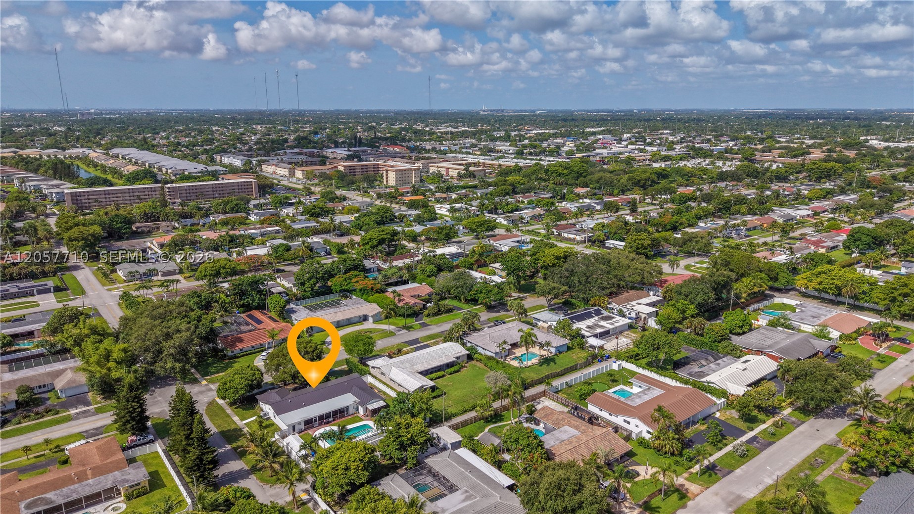 Incredible One-story house for sale.UNIQUE OPPRTUNITY! 5 BR 4 BA / ADDITIONAL APARTAMENT WIH 1/1- LOTS OF SPACE! Ejoy the large open kitchen with stainless steel appliances. Includes a family room with wet bar overlooking the patio and enormous pool, a massive 14,000 square foot backyard with ample roofer additions and potential for boat/ RV storage or sports fields, and a two- car garage that converts to a studio. High impact windows, quartz countertops.This centrally located home is within walking distance to entertainment, schools, parks, playgrounds and shopping centers. Just ten minutes from the newly built Hard RockHotel & Casino, Hollywood Beach.