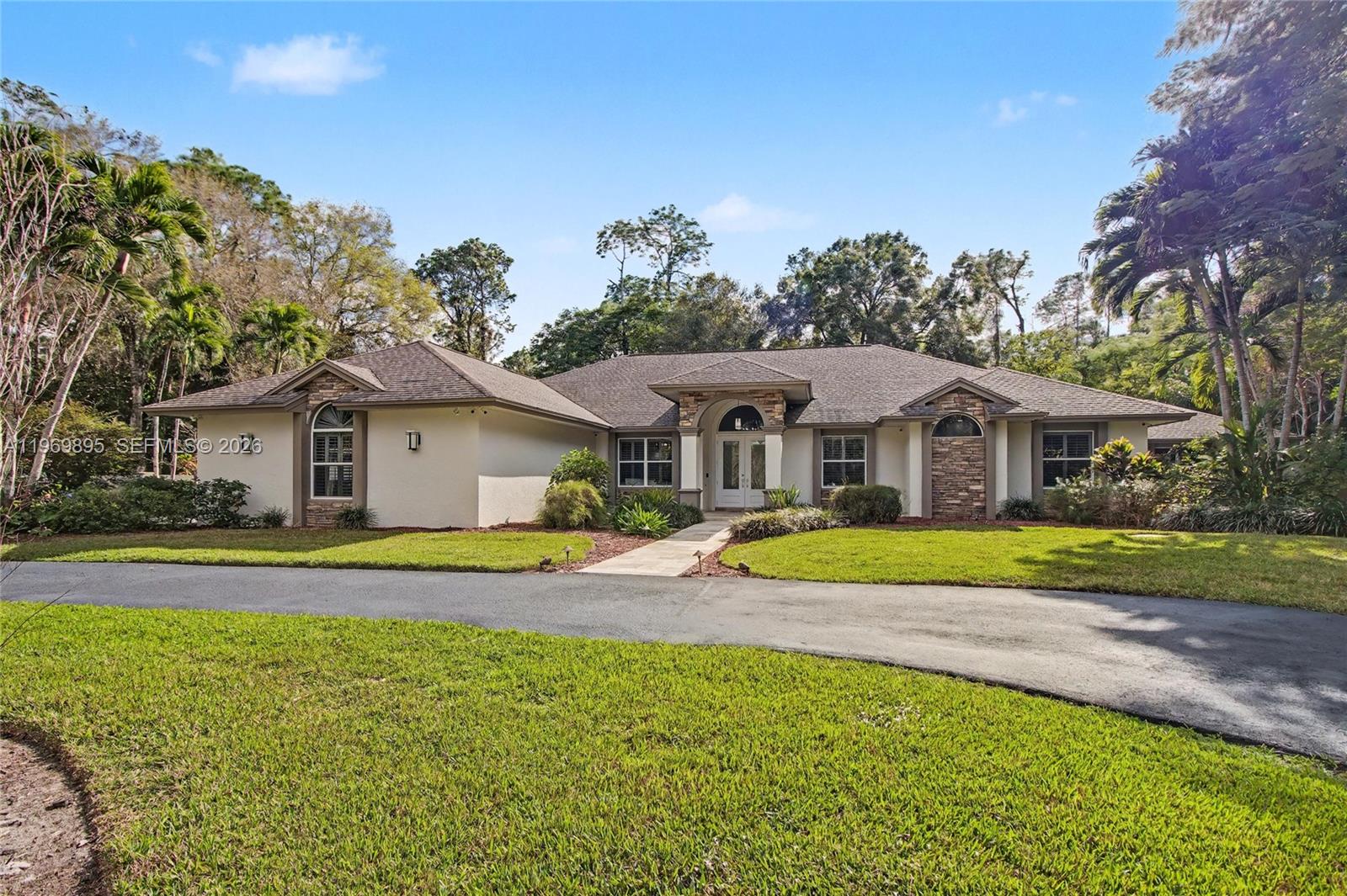 Exceptional estate offering 4 BR, 2 DENS, & 4 BA, set on 2.73 ACRES in highly Logan Woods desirable area, ideally located in the heart of the city while still offering privacy & space. This expansive residence is designed for elevated living with generous proportions & an open, welcoming, seamlessly connected layout. Interior highlights include a FULL THEATER RM with MOTORIZED RECLINERS (SEATS 6), striking CUSTOM-LIT GLASS ART FEATURE, FIREPLACE, CENTRAL VAC, SECURITY CAM SYS, INDOOR WET BAR, & WHOLE-HOME RO WATER SYS. The PRIMARY BA is beautifully appointed & includes a BIDET, while everyday functionality is enhanced by an IN-HOUSE LAUNDRY RM & OVERSIZED 2-CAR GARAGE. One DEN can easily convert to an add’l BR. A PRIVATE IN-LAW STE provides excellent versatility for guests or multigenerational living w/o disrupting the home’s overall flow. Outdoor living is truly resort-inspired, featuring a HEATED POOL & SPA within a SCREENED ENCLOSURE, a 2ND SCREENED PATIO for shaded lounge space, & an OUTDOOR SHOWER. Entertain effortlessly in the OUTDOOR KITCHEN beneath a GAZEBO with GAS COOKTOP, or gather around the PAVERED FIRE PIT AREA for evenings under the stars. The property is beautifully landscaped with AUTO SPRINKLER SYS & includes a STORAGE SHED for additional convenience. Offering acreage, luxury amenities, & a prime central location with NO HOA, this home presents a rare opportunity to enjoy estate living without sacrificing convenience.