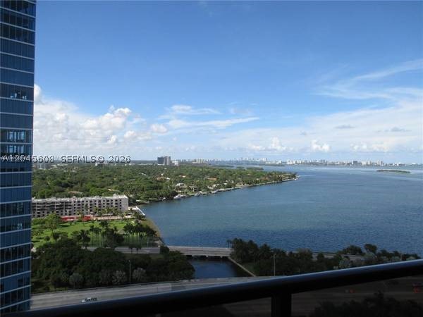 Stunning Penthouse 3-Bedroom, 2.5 Bathroom Open-concept design, 2 stories. High-end wood finishes and dark wood floors. Floor-to-ceiling windows. Panoramic bay views.  A convenient in-unit laundry room with a full-size washer and dryer adds convenience. Two assigned parking spaces and ample guest parking ensure hassle-free living. Prestigious building in the heart of the city. Enjoy access to a world-class fitness center, a sparkling bayfront pool, sauna, Jacuzzi, and inviting common areas. With 24-hour security and concierge services. Minutes from Midtown and the Design District. Cable and internet included.