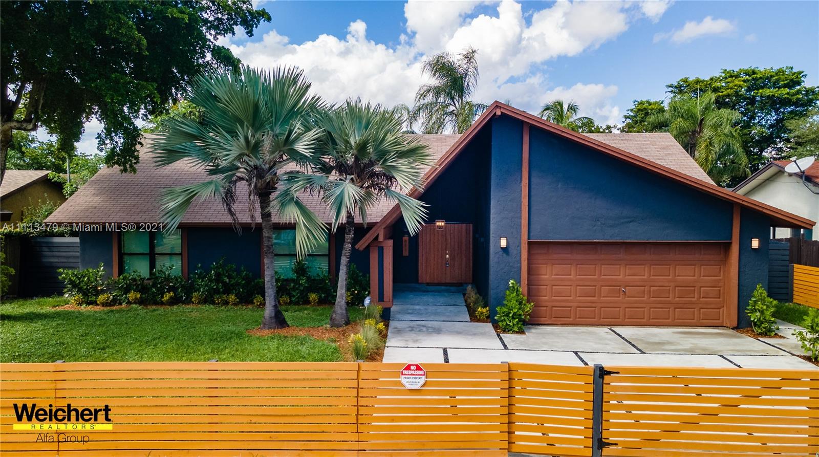 What a gorgeous place to call home! This spacious 3 bed/2bath house features a large open living space, vaulted ceilings, two car garage and a swimming pool! As you pull up to the home your greeted with a modern concrete driveway that extends as a walk way to your front door and wraps around the home to the pool area and pool deck. Entering through the double front doors you'll have an expansive open living space with vaulted ceiling! Tons of natural sunlight from your impact sliding glass doors and a wonderful view of your pool and pool deck. Also Featuring a one of a kind designer kitchen and Beautiful custom polished concrete floors. The master bedroom has his and hers closets and a giant bath with a tub and shower! To many custom upgrades to list! This is a must see! GREAT LOCATION!