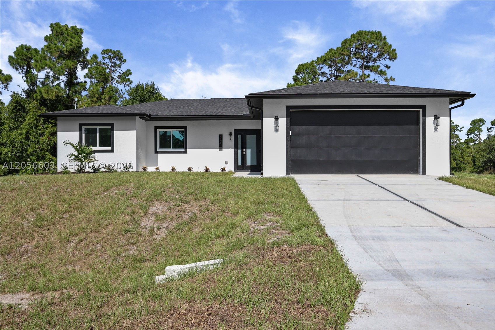 Welcome to this brand new 2026 built home offering 4 bedrooms and 3 baths (2 full, 1 half) across 1,632 sq ft of living space, set on a spacious .26 acre lot. Inside, the kitchen is a standout, featuring a large island, sleek white cabinetry, quartz style counters, and a full suite of stainless steel appliances including a gas range, dishwasher, disposal, and self cleaning oven. It opens seamlessly into the great room and dining area, all finished with tile flooring throughout for a clean, modern feel. The split bedroom layout offers privacy and flexibility, with a primary suite featuring a walk in closet and en suite bath, while the remaining bedrooms are thoughtfully separated, each with generous closet space. Additional features include an interior laundry room, an open, covered back porch overlooking the backyard, impact resistant doors and windows, and an attached 2 car garage. Built for comfortable, low maintenance living, and located in a no subdivision setting in Southeast Lehigh Acres, this move in ready new build offers a great opportunity for buyers seeking modern construction with room to make it your own.