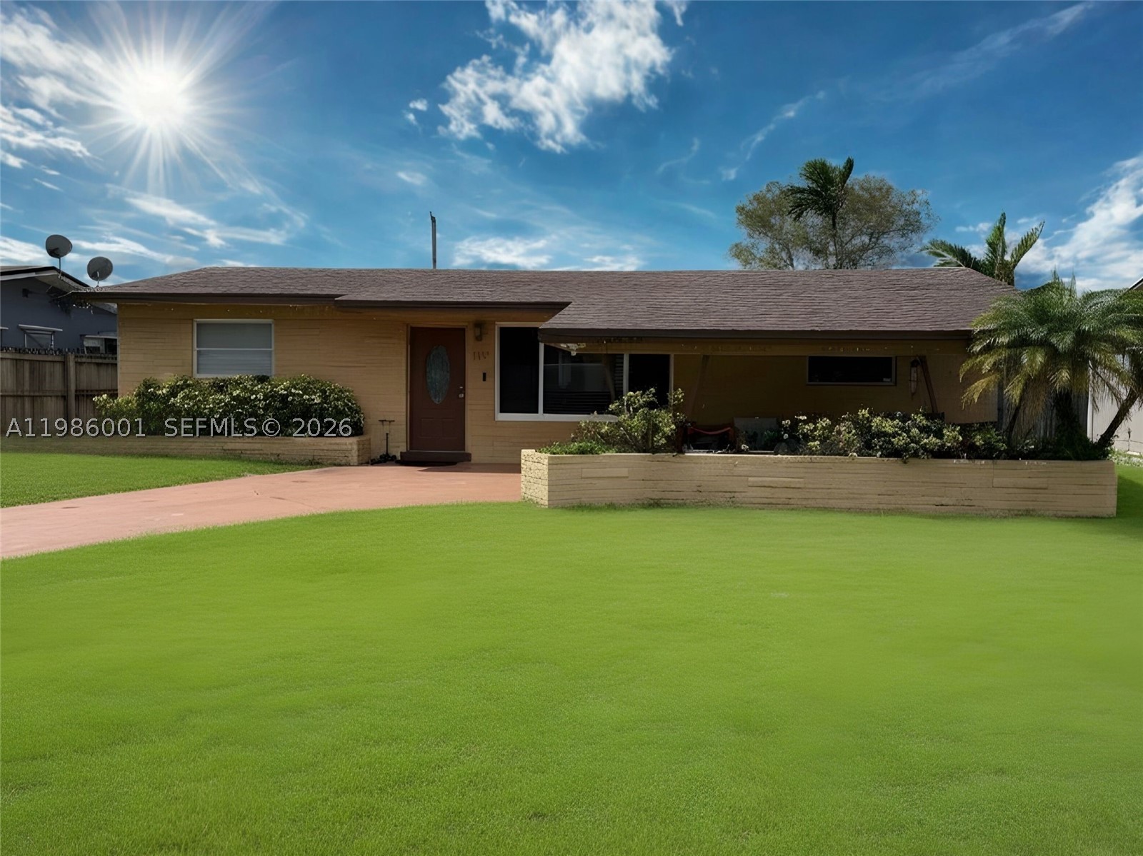 NO HOA! Discover this meticulously maintained 3-bedroom, 2 bathroom home featuring a roof less than 10 years old and a young AC system. The interior boasts very spacious layout with an split floor plan, a mix of classic tile and modern waterproof flooring in all bedrooms. Open kitchen with granite countertop and new refrigerator. Enjoy added peace of mind with impact windows in the living room and both bathrooms. This property is an entertainer's dream with an oversized back patio overlooking an expansive, empty lot—providing ultimate privacy with no rear neighbors. The large driveway accommodates up to 5 cars comfortably. Connected to city water and sewer. Enjoy your own mature avocado tree in the massive backyard! Move-in ready and perfectly situated close to major expressways,  popular areas and much more....