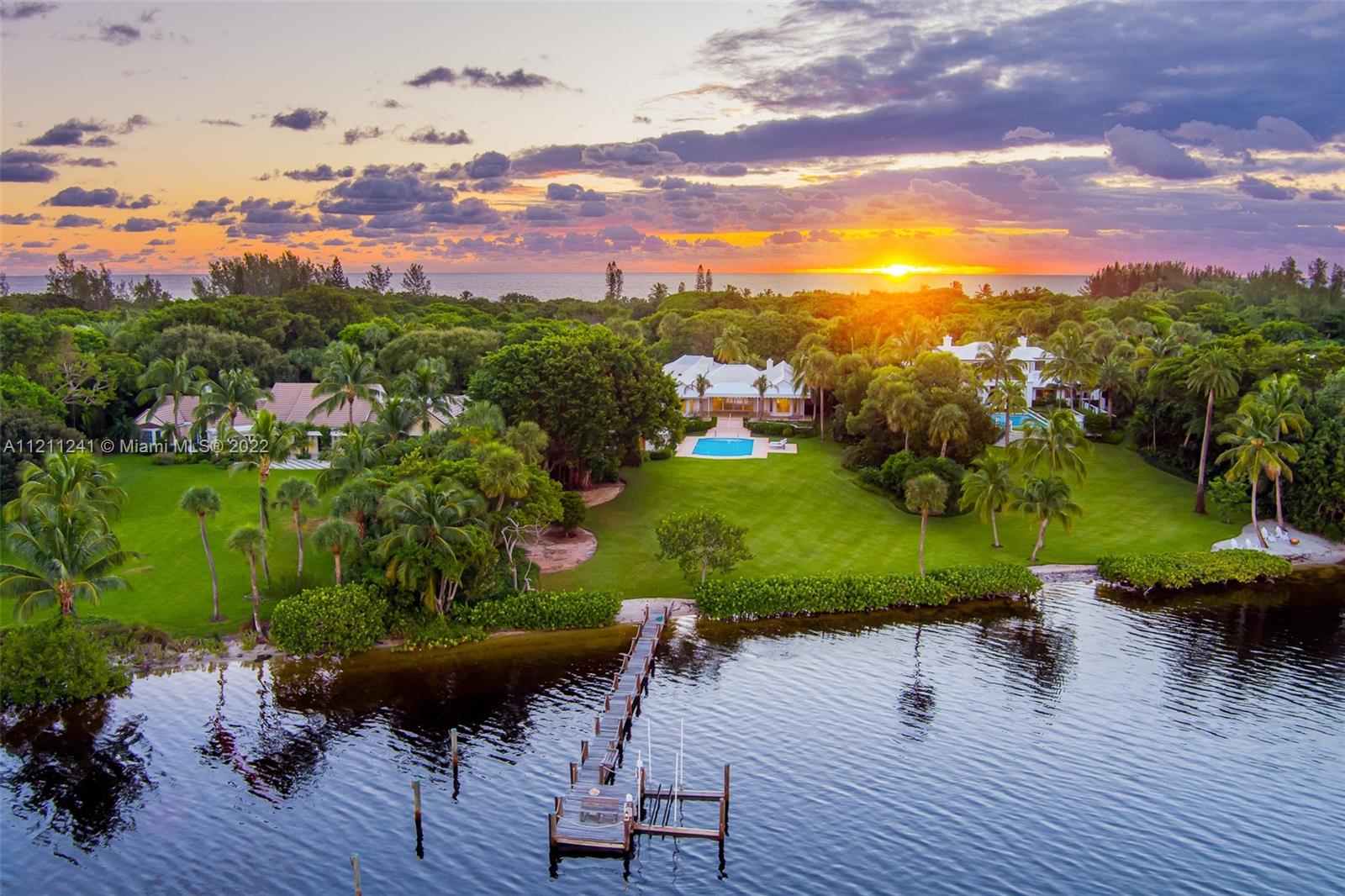 A rare Intracoastal-to-Ocean estate with deeded beach access available on Jupiter Island. The property sits on over 3.6 acres of exotic landscape with incredible views of over 137.57 feet of Intracoastal, including a dock and private beach, 133 feet of ocean views, and 2 custom golf holes and greens.
The main house spans 6,368 SF with 2BD, 2.2BT, a library, an office with a bar, and abundant natural light.
The guest house spans 1,283 SF, 2BD and 2BT, a living room, and a kitchenette. The home features a generator, Aqualine water filtration system, electric storm shutters, heated saltwater pool, new window treatments throughout, and much, much more.
The property also allows for plenty of room for expansion if desired.
This spectacular estate is a once-in-a-lifetime opportunity!