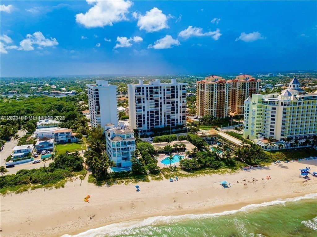 BEAUTIFULLY UPDATED, 2/2 IN THE SHORE CLUB WITH RESORT STYLE CLUB HOUSE ON THE SAND! TIKI BAR & GRILL, 2 GYMS, LARGE POOL & HOT TUB WITH PRIVATE BEACH ACCESS! YOUR SEMI-PRIVATE ELEVATOR OPENS TO A LARGE FOYER, OPEN LIVING ROOM, FORMAL DINING ROOM &  BRIGHT EAT IN KITCHEN WITH WASHER & DRYER. IMPACT DOORS & WINDOWS WITH OCEAN, PARK                  & CITY VIEWS- WATCH SUNRISE AND SUNSETS FROM YOUR LARGE BALCONY! BATHROOMS & KITCHEN UPDATED, LARGE WHITE PORCELAIN TILE THROUGOUT, SPACIOUS MASTER BEDROOM WITH 2 CLOSETS. BIKE, PADDLEBOARD & KAYAK STORAGE & 24 HR GUARD GATE. 1 ASSIGNED GARAGE SPACE, EV CHARGING STATIONS, ADDITIONAL STORAGE & LOTS OF GUEST PARKING!!