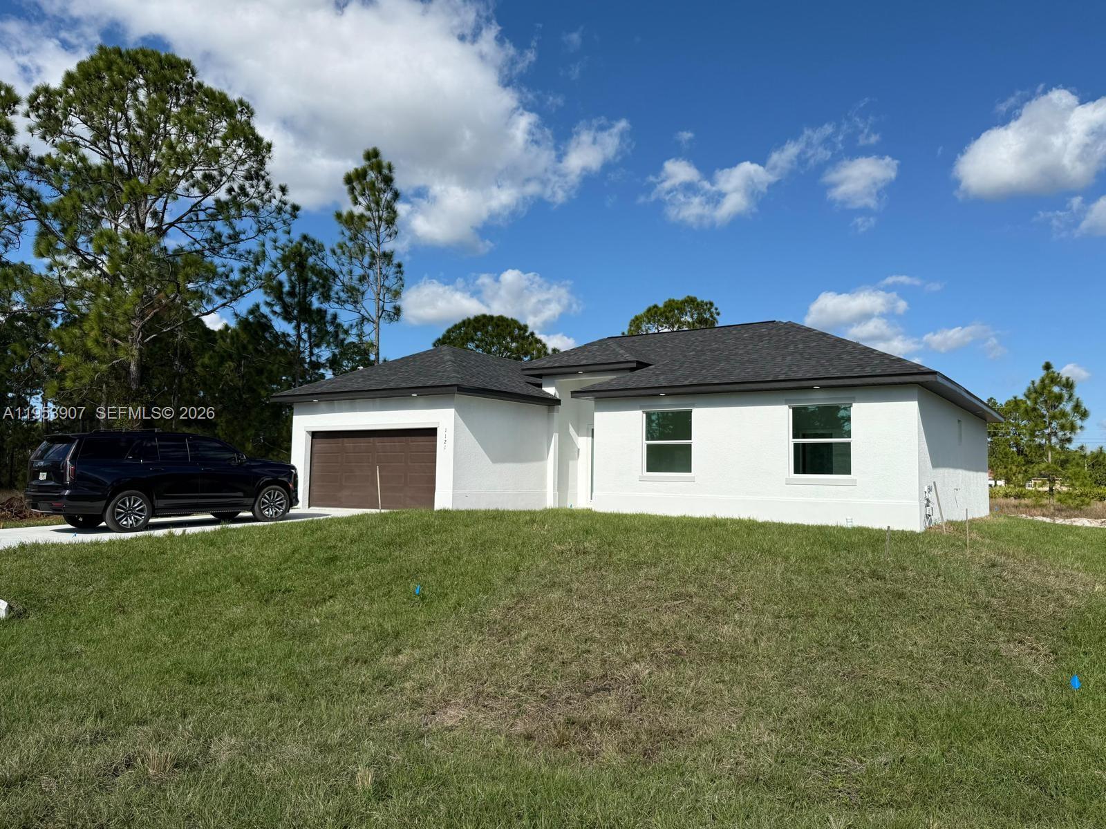Brand new construction !! This beautiful single-family home located on a corner lot features 3 bedrooms plus a den that can be used as a fourth bedroom, home office or playroom, 2 full bathrooms, and a 2-car garage. Open floor plan with porcelain flooring throughout, modern kitchen with quartz countertops, stainless steel appliances, and custom cabinetry. Includes laundry room, central A/C, and impact windows. Covered patio and spacious backyard. Available for sale or rent. This move-in ready home is ideal for families, professionals, or investors seeking quality new construction in Lehigh Acres, FL. (Lot next door also might be for sale if buyers is interested)