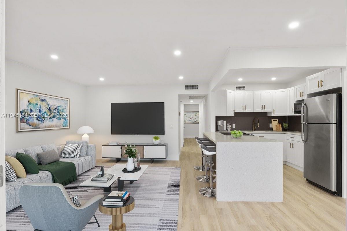 Enjoy this complete remodeled 2 bedroom, 1 and 1/2 bath condo, with modern open concept, new flooring, new kitchen and quartz. counter top, smooth ceilings,LED lights throughout the unit, new bathrooms, relaxing pool view from the bedrooms, walk in closet, huge attic storage, convenient location near to the entrance on Pines Blvd and I-75. Use the enclosed balcony as an office or work space with additional closet. Parking space near to the elevator. HOA includes water, basic cable, internet and endless amenities including on-site golf, tennis, gym,indoor pool, theater, social activities FREE SHUTTLE to malls, grocery stores. 55+ Community Century Village Pembroke Pines, no one under 18 allowed. Per Association 650 Credit score . Text listing agent for showings. Unit occupied until Feb 28th by tenants