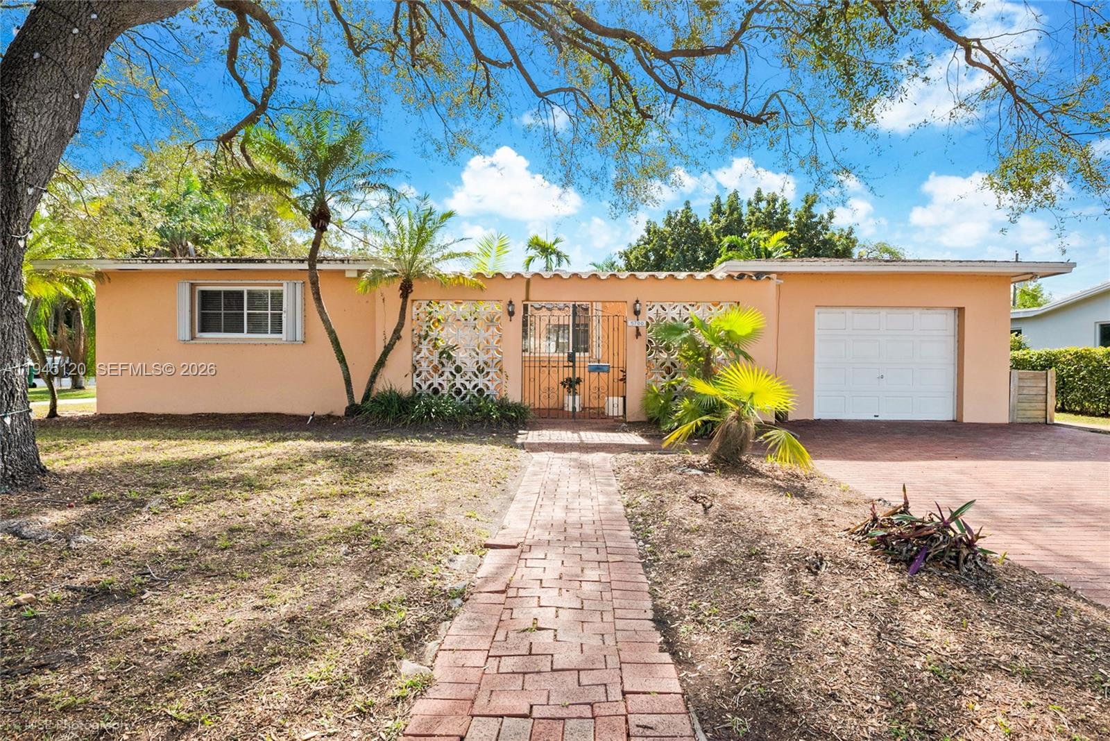 REDUCED! Owner motivated. This spacious corner home is one block west of Coral Gables.  Private dead end street. Close to shopping and restaurants.  Sought after neighborhood with top rated schools.  Remodeled kitchen and baths with stainless steel appliances. Close to University of Miami.  Large family room. Very large lot all fenced in.  Ready to move in, remodel and/or expand. Main house is 3 bed/2 bath plus a very large in-law quarter which is 1 bed/1bath.  Very easy to show.  Tenant occupied. Bring your best and highest offer.  One of a kind.  Will not last.