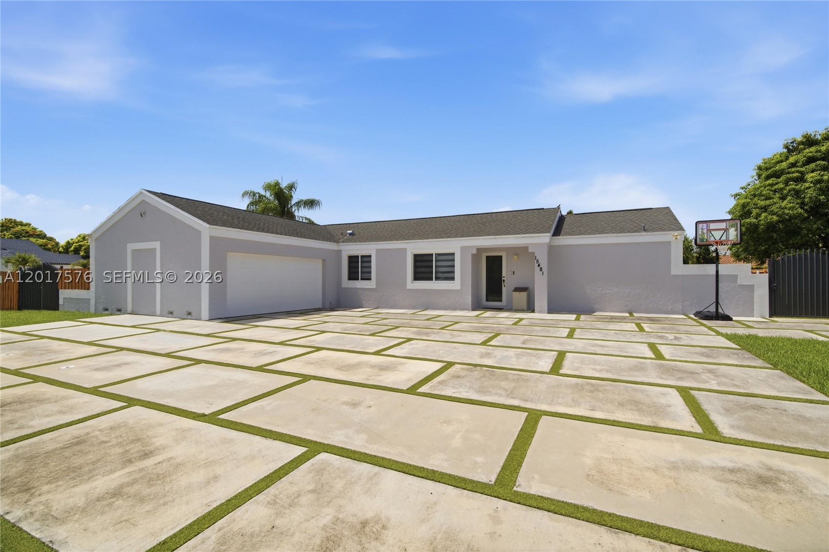 This beautiful home sits on an oversized 13K sq. ft. corner lot with a large, screened terrace, pool, privacy wood fence and tiki hut, excellent for entertaining with huge driveway for family and guests. Park an RV or boats along the extra wide side of this house and save on storage with plenty of space for all your toys plus a 2-car garage. Impact windows & doors, impact rated/insulated garage door, extra-large driveway, zebra shades, and ceramic floors. Quiet neighborhood with great neighbors. Grocery store + shops blocks away. Plenty of yard space for family and pets. Exterior freshly painted & pool replastered, new roof in 2017.