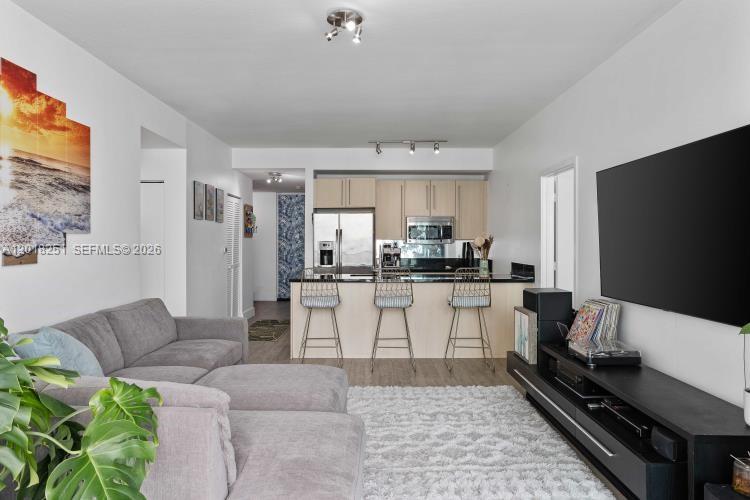 Beautiful 2/2 + extra den/office & 2 parking spaces (not tandem#4089/#4054) Experience urban living at its finest in this wonderful 31st floor unit in Axis on Brickell. Centrally located in the heart of Brickell just steps away from the Metrorail, Metromover, free trolley service, Mary Brickell Village & Brickell City Ctr. Split floor plan w/stunning Miami sunset views from lge balcony that opens from every room! Unit features 9-foot ceilings, granite countertops, stainless steel appliances, new dishwasher tile floors & modern bathrooms with new glass doors. Best amenities, two pools, hot tub, fitness center, and separate men's & women's spa facilities. Residents also have access to a party room, children's playroom, conference room, BBQ area 24-hour security, valet parking & concierge svcs.  Tenant occupied till Aug 31, 2026 ~ 24 hour prior notice to show ~