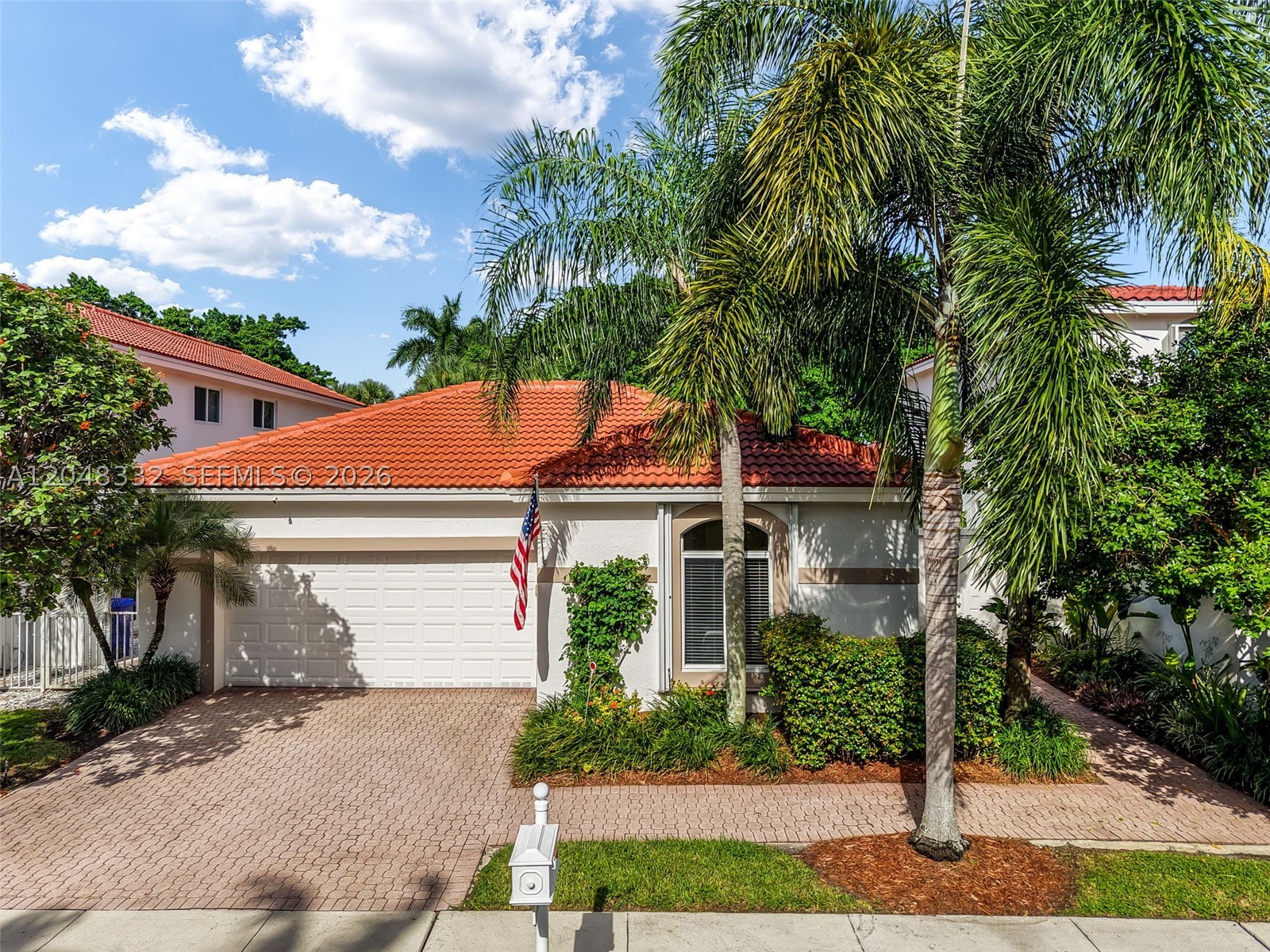 Welcome to Grand Palms, one of Pembroke Pines’ most desirable communities! This beautifully renovated 3BR/2BA courtyard home blends comfort, style, privacy, and functionality. Its open floor plan is filled with natural light and centers around a private heated pool. The gourmet kitchen features premium stainless steel appliances, range hood, wine cooler, large island, and abundant cabinetry, flowing seamlessly into the dining, living, and family rooms. The spacious primary suite includes a sitting area ideal for an office, nursery, or retreat, plus a remote-controlled exterior shade for instant privacy. The spa-inspired bath offers marble floors, quartz vanity, frameless glass shower, and a soaking tub. A custom California-style walk-in closet provides exceptional organization. Two additional bedrooms are generously sized, and the second bath opens to the pool. Limestone floors enhance the living areas, with warm wood flooring in the bedrooms. Extras include a hammock area, laundry room, EV socket, 2021 roof, new water heater, and new A/C with 10-year equipment and 1-year labor warranty. Near highways, shopping, dining, hospitals, and top-rated schools. Truly move-in ready!
