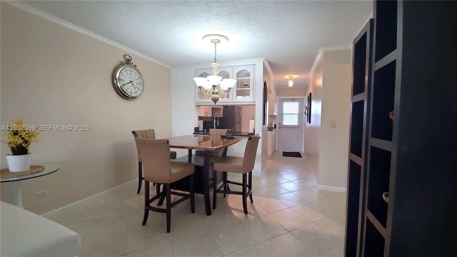 Charming furnished 1-bedroom, 1-bath residence in the Paradise Isle community, a private island within the desirable Golden Isles neighborhood. Located in a boutique three-story co-op building, this upgraded unit features an open balcony with serene canal and water views. Interior highlights include updated kitchen cabinetry with granite countertops, tile flooring throughout, and tasteful furnishings. Move-in ready and fully equipped. Community amenities include a heated pool, barbecue area, shuffleboard, and bocce court. Ideally situated just steps from Hallandale Beach, Gulfstream Park, premier dining, shopping, and entertainment.