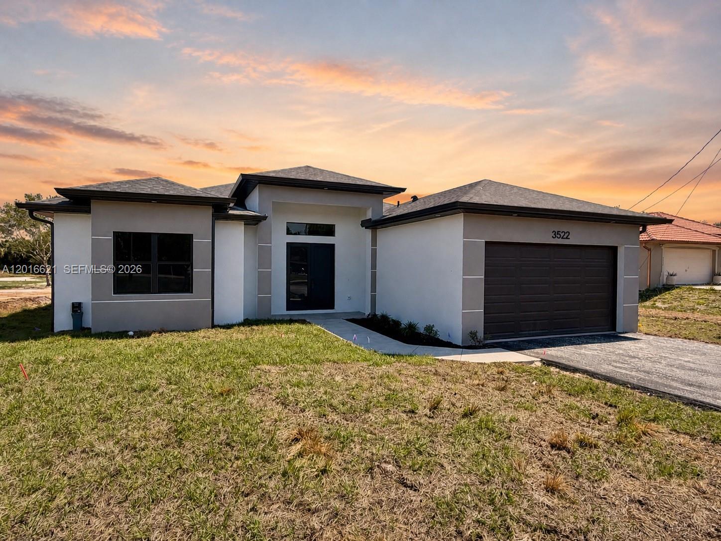 Spacious and thoughtfully designed 4-bedroom, 2-bath home situated on a 100% upland lot on Randall Blvd, offering full usability with no wetlands restrictions. This property features 2,004 sq ft of living area with an open-concept layout & split-bedroom floor plan, providing both functionality and privacy. The interior showcases generously sized rooms throughout, including an expansive living and dining area ideal for entertaining. The oversized kitchen offers ample workspace and storage, seamlessly connecting to the main living areas for a cohesive flow. Step outside to a large lanai, perfect for outdoor living and enjoying the peaceful surroundings. The home is finished with quality upgrades and modern details throughout, delivering a clean, move-in-ready feel. Located in a rapidly developing area, this property is just minutes from the growing dining and retail expansion along Randall Blvd & surrounding area, adding strong long-term value and convenience. No HOA. Plenty of space for a pool, workshop, RV, or boat. A rare combination of location, land usability, and interior scale in Golden Gate Estates.
